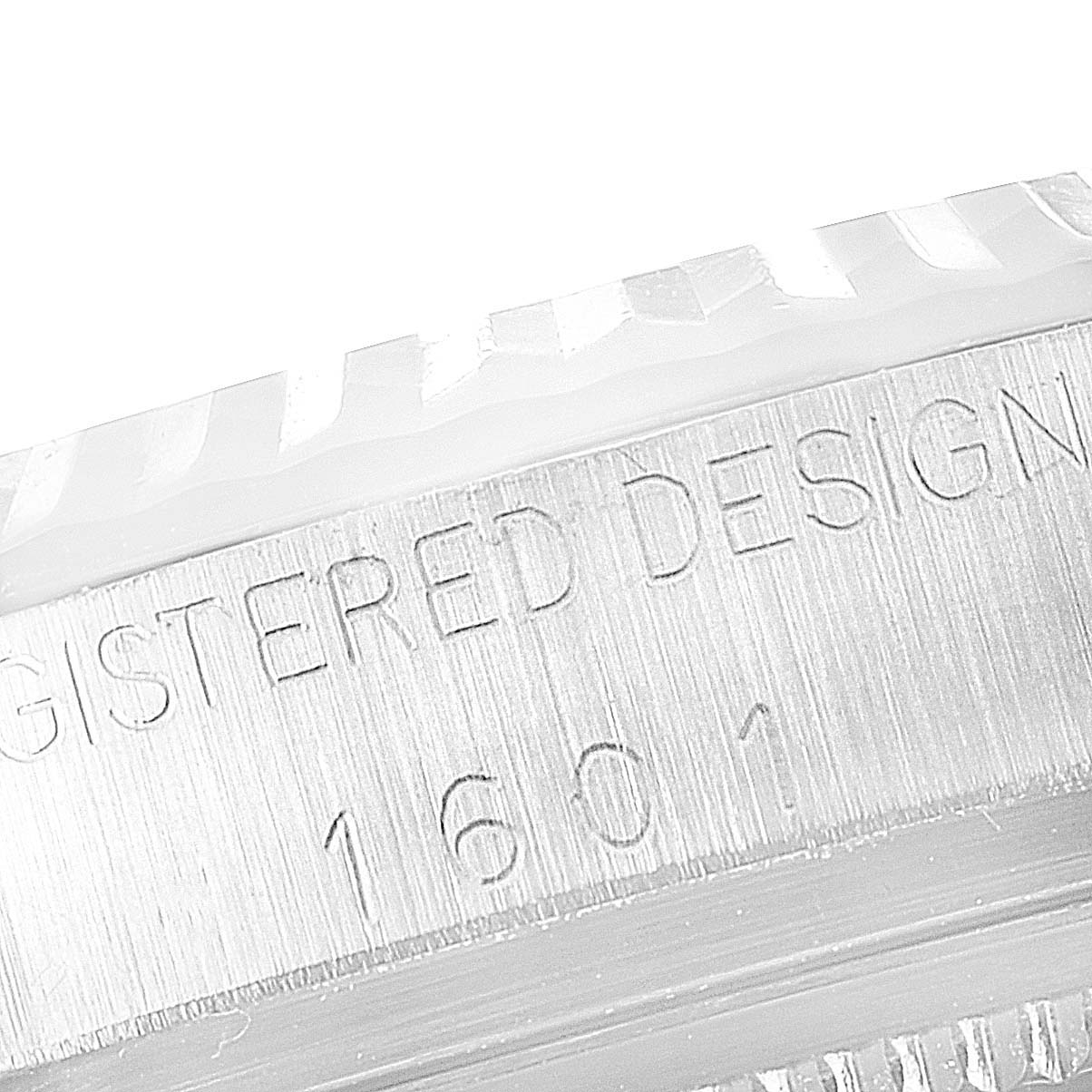 The image shows a close-up view of the bezel and part of the casing of the Rolex Vintage Collection 1601 Men's Stainless Steel Grey Dial 1601 Men's Stainless Steel Grey Dial watch, model 1601.