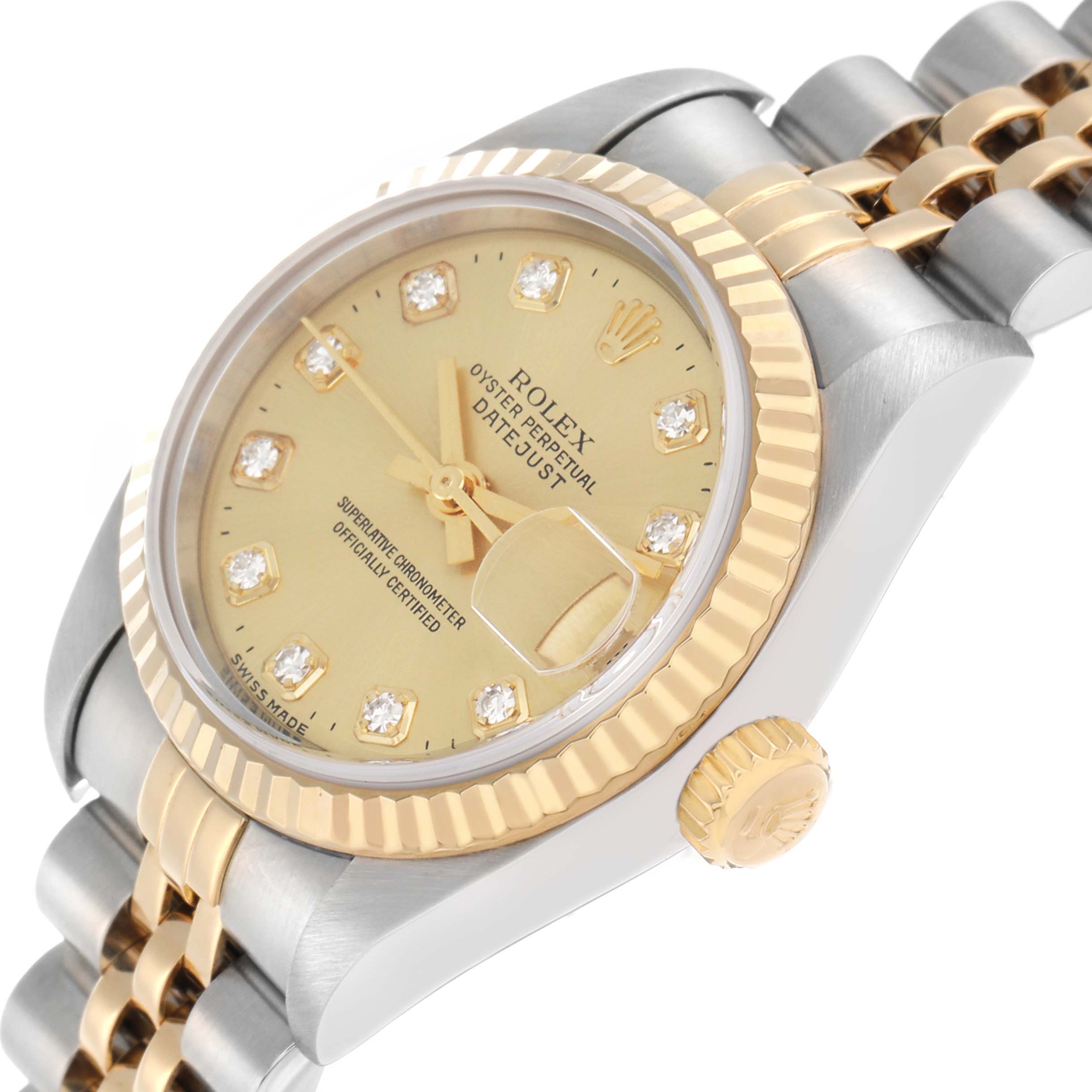 The Rolex Datejust 79173 Women
s Steel and Gold (two tone) Champagne Dial watch is shown at an angled side view, highlighting the dial, bezel, and part of the bracelet.