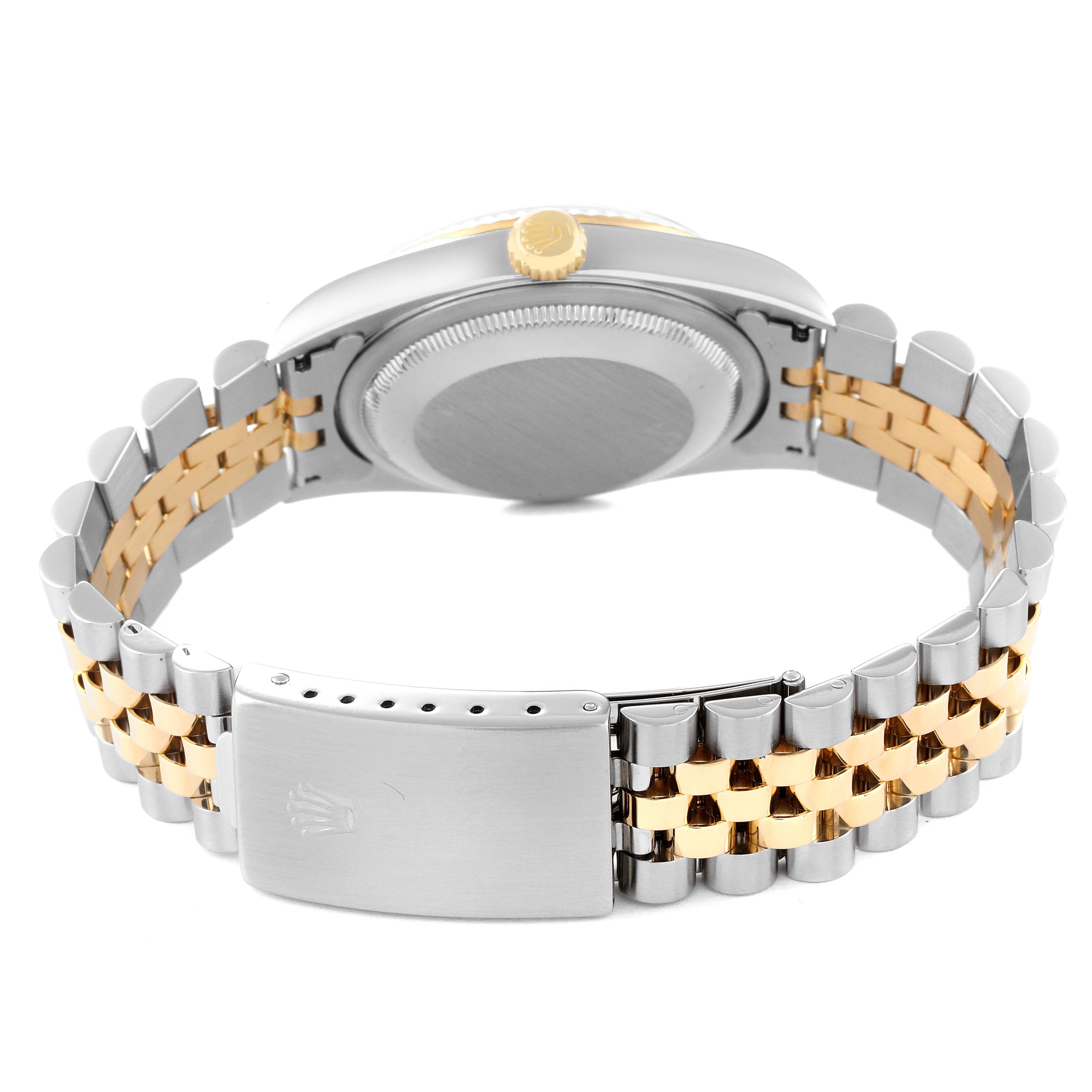 The Rolex Datejust 16233 Men's Steel and Gold (two tone) Mother of Pearl Dial 16233 Men's Steel and Gold (two tone) Mother of Pearl Dial watch is shown from the back, displaying its case back and two-tone jubilee bracelet with clasp.