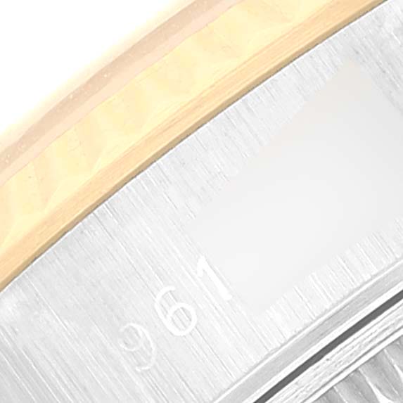 The image shows a close-up of the bezel and part of the serial number engraving on a Rolex Datejust 69173 Women's Steel and Gold (two tone) Silver Dial 69173 Women's Steel and Gold (two tone) Silver Dial watch.