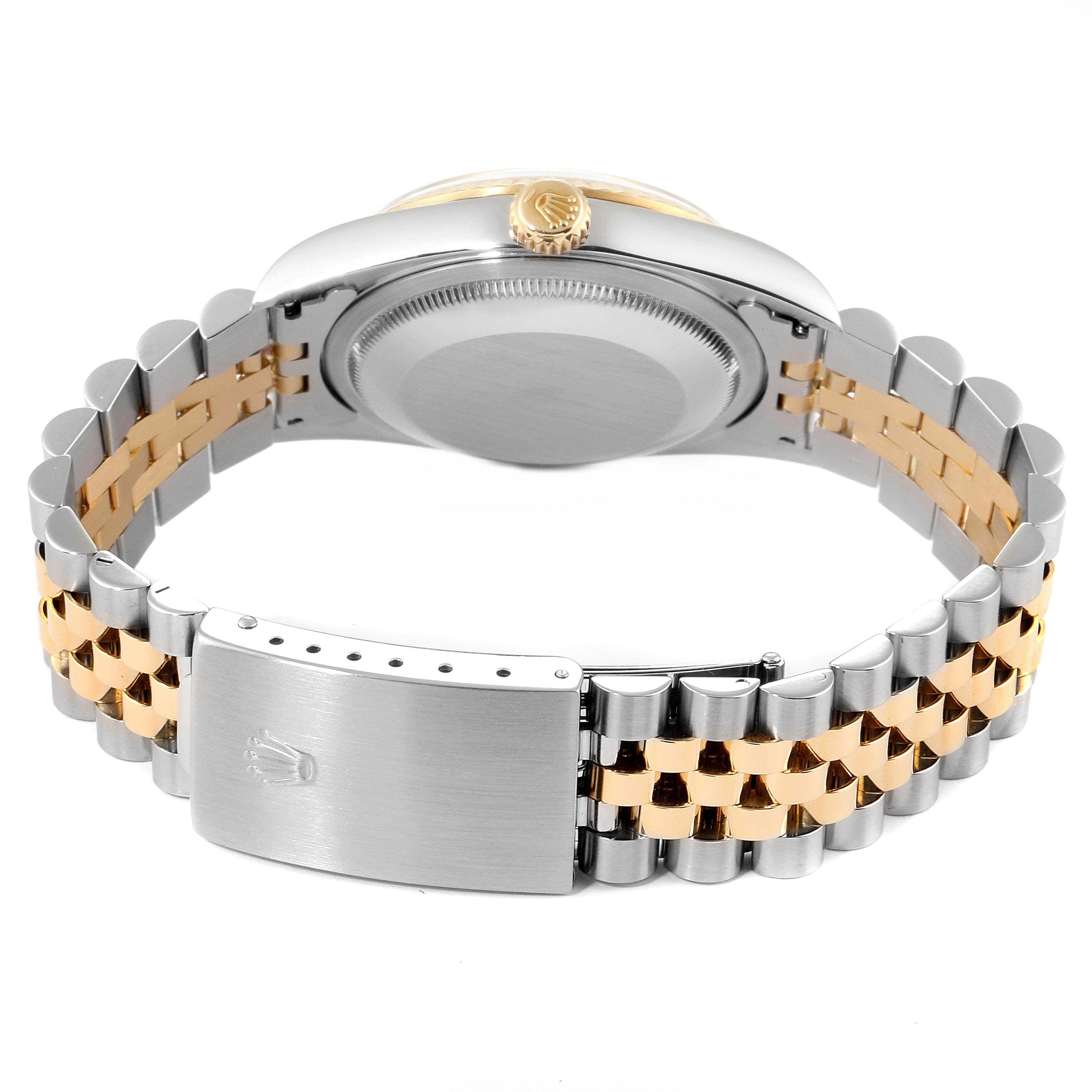 The image shows the back of a Rolex Datejust 16233 Men's Steel and Gold (two tone) Grey Dial 16233 Men's Steel and Gold (two tone) Grey Dial watch, displaying its case back, crown, and two-tone bracelet with clasp.