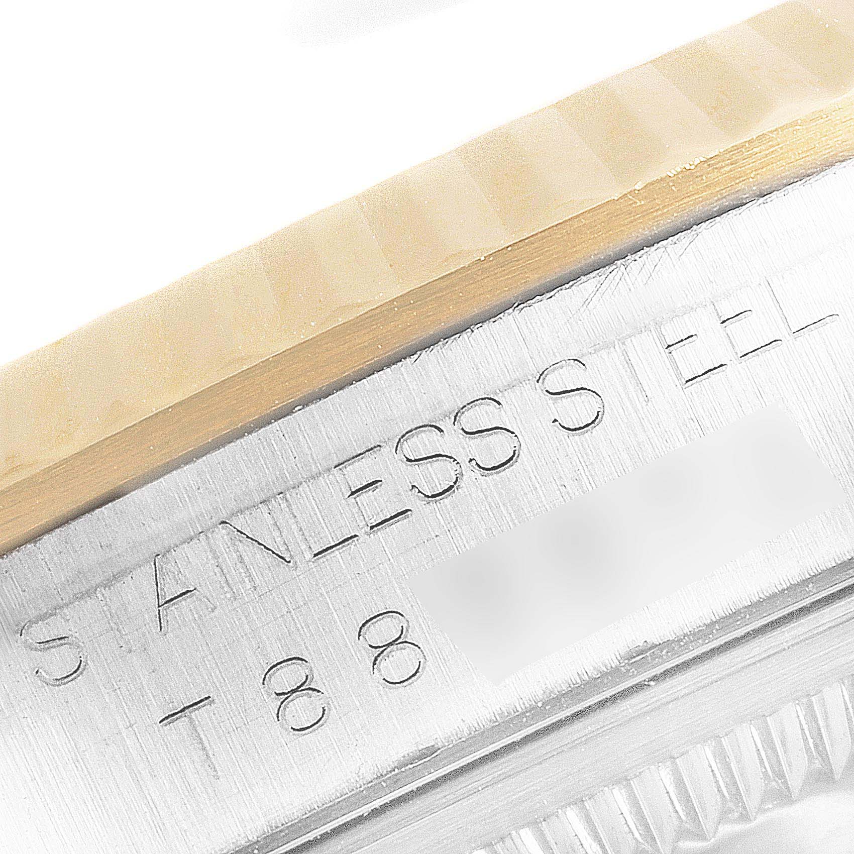 The image shows a close-up of the stainless steel case and bezel of a Rolex Datejust 16233 Men's Steel and Gold (two tone) Grey Dial 16233 Men's Steel and Gold (two tone) Grey Dial watch.