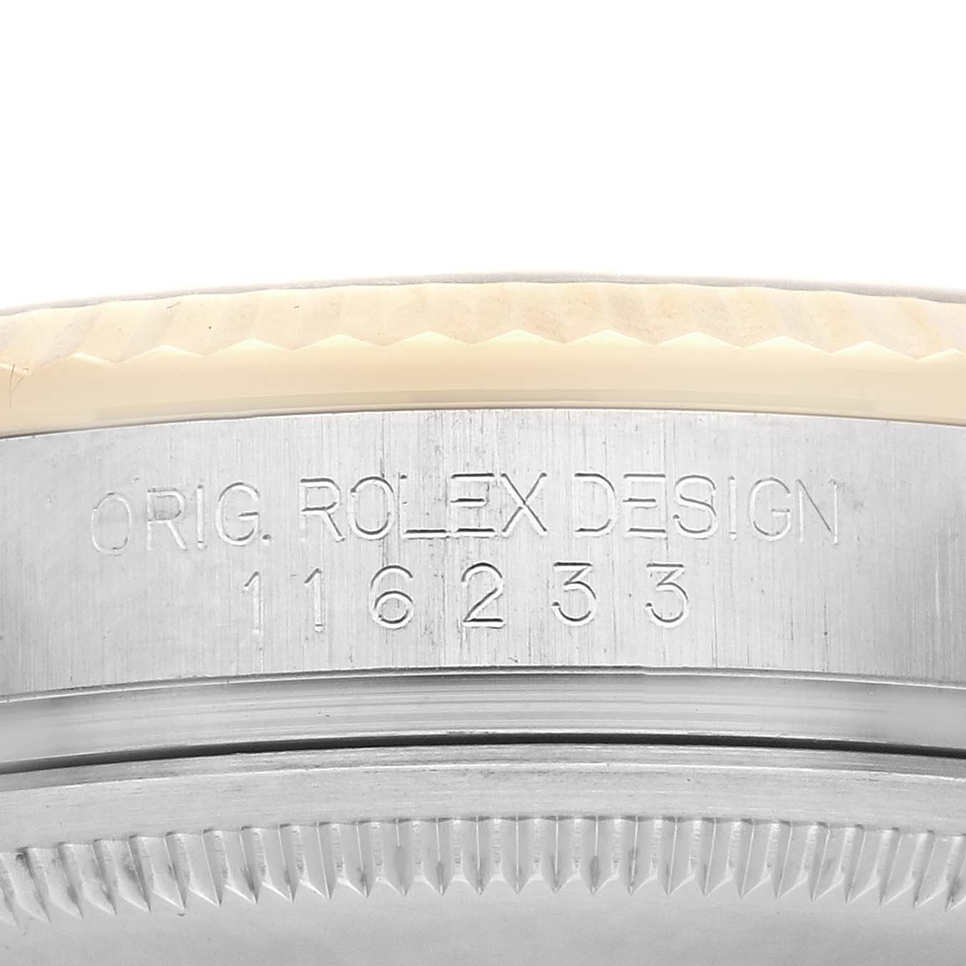 The image shows the side of a Rolex Datejust 116233 Men
s Steel and Gold (two tone) White Dial watch case, highlighting the engraved design and model number.