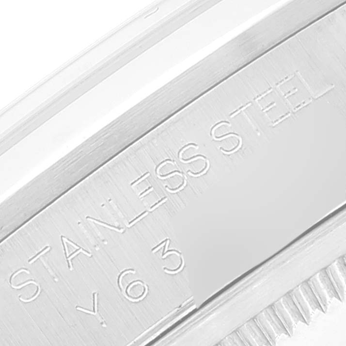 Close-up of the Rolex Datejust 16200 Men's Stainless Steel White Dial 16200 Men's Stainless Steel White Dial watch, focusing on the engraved "STAINLESS STEEL" text and some serial numbers on the case.