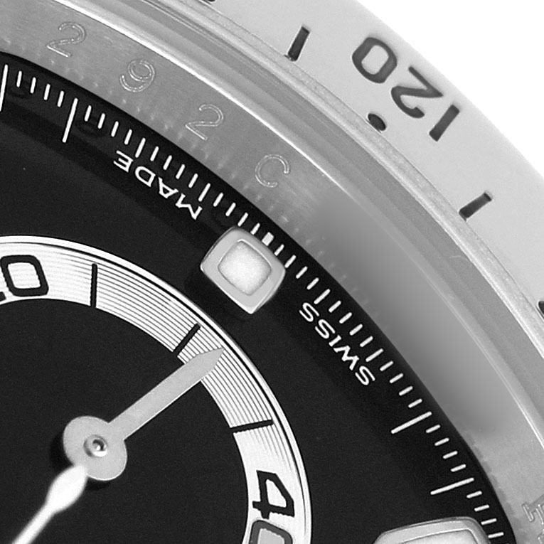 The image shows a close-up of the dial and bezel of a Rolex Daytona 116520 Men's Stainless Steel Black Dial watch, highlighting the subdial and part of the tachymetric scale.