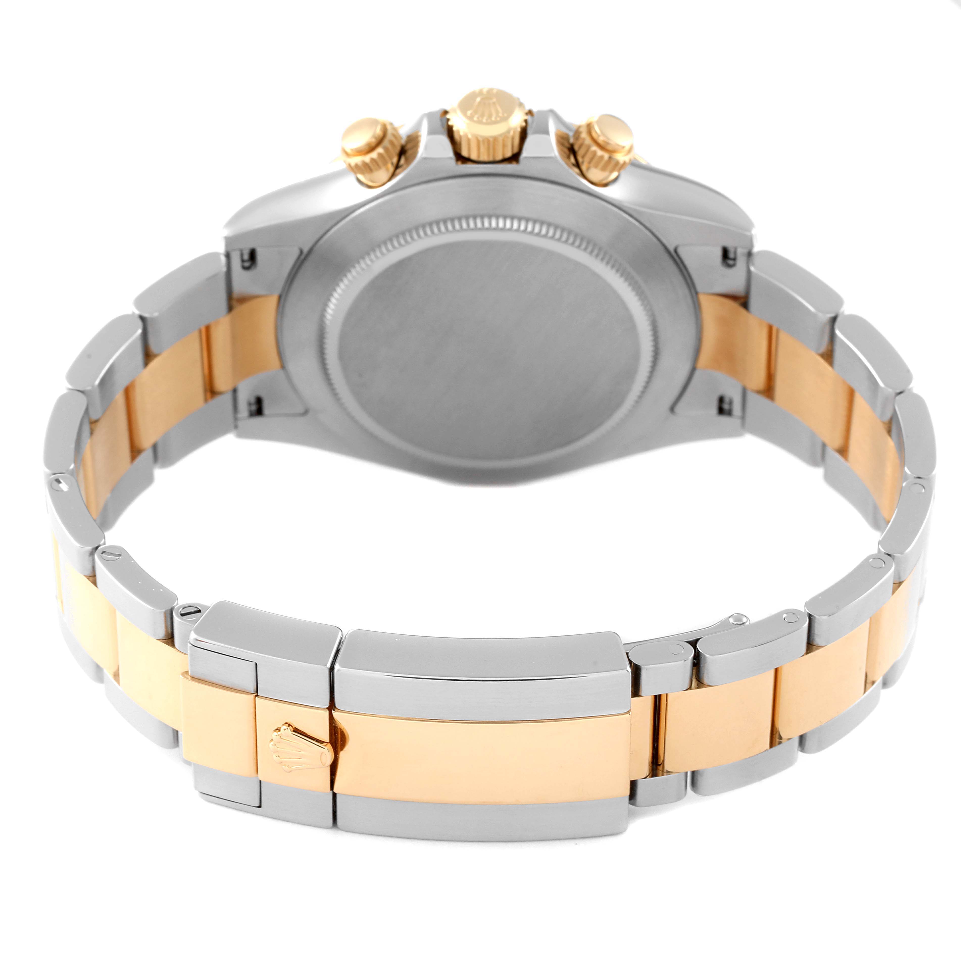 This image shows the back view of the Rolex Daytona 116523 Men
s Steel and Gold (two tone) White Dial 116523 Men
s Steel and Gold (two tone) White Dial watch, highlighting its case back, bracelet, and clasp.