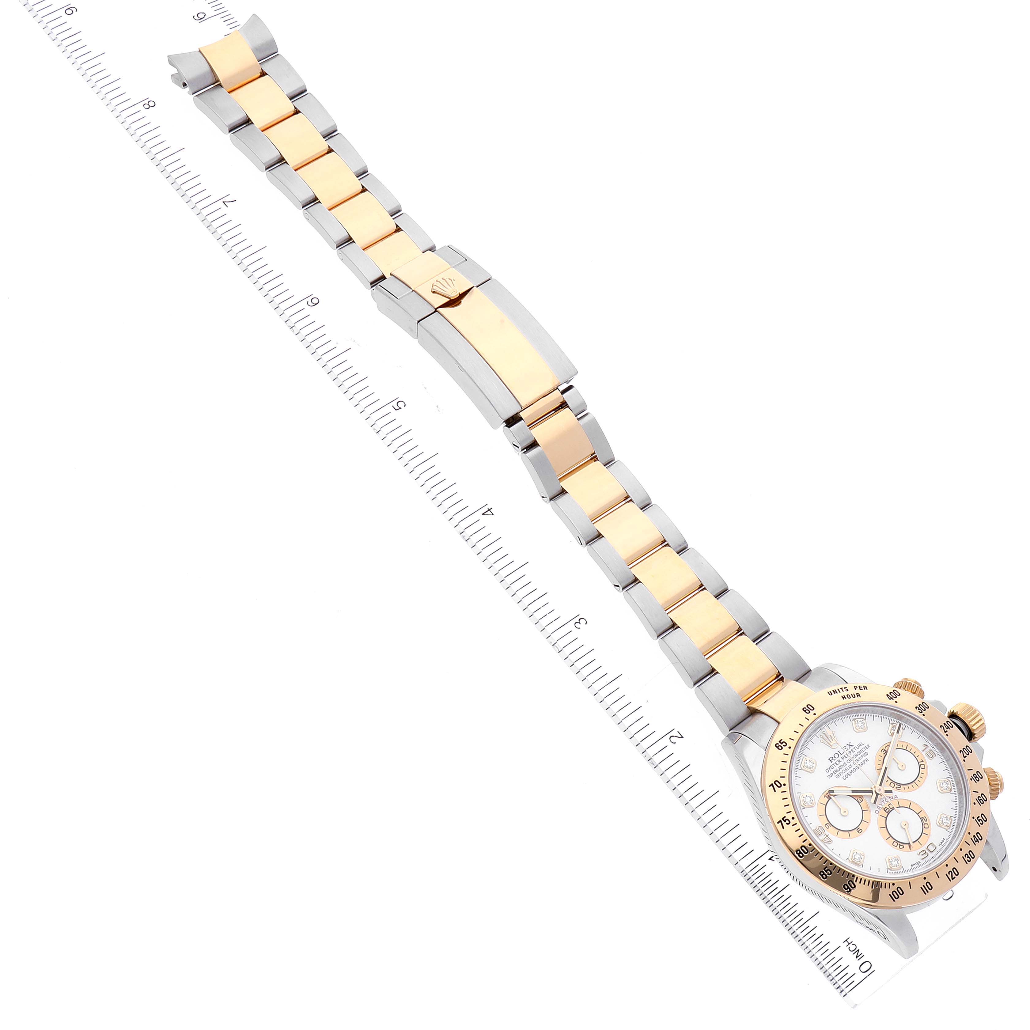 The image shows a Rolex Daytona 116523 Men
s Steel and Gold (two tone) White Dial 116523 Men
s Steel and Gold (two tone) White Dial watch from an overhead angle, highlighting its gold and silver bracelet with the clasp and dial.