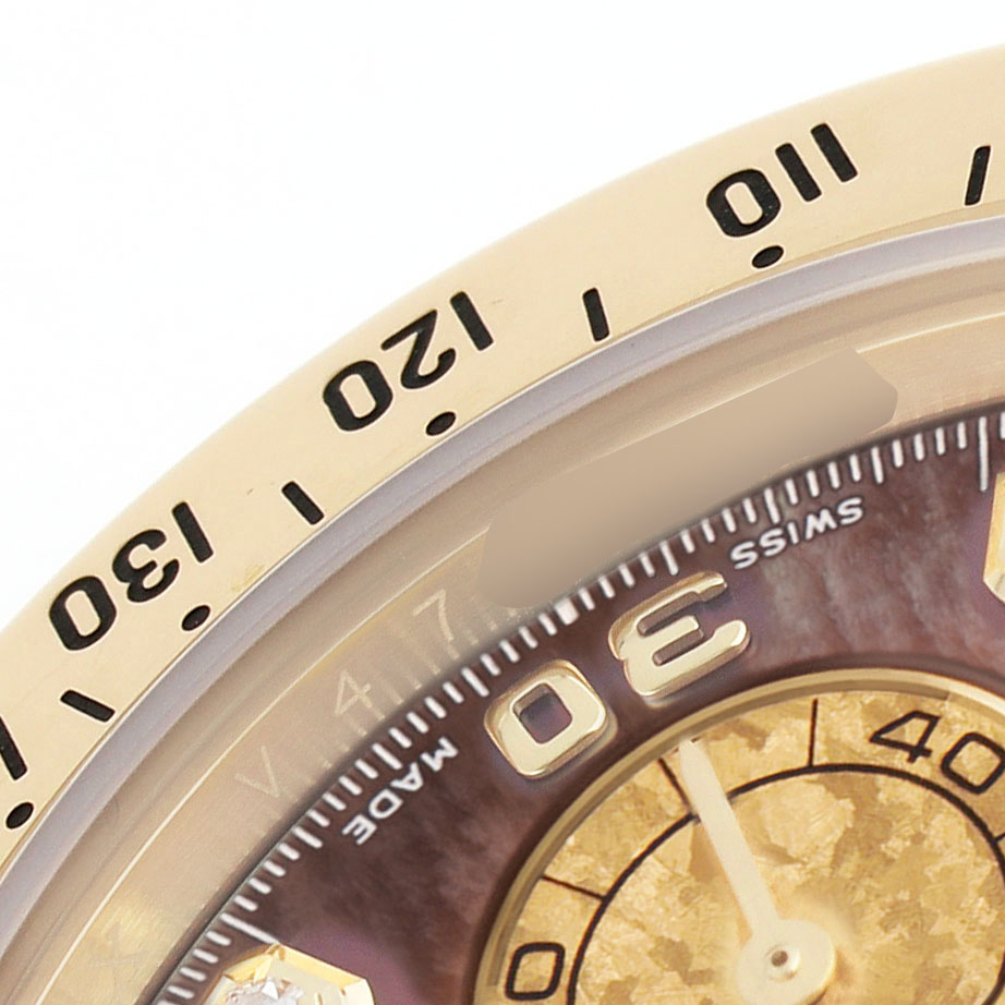 The image shows a close-up of the bezel and part of the dial of a Rolex Daytona 116528 Men's Yellow Gold Mother of Pearl Dial watch.