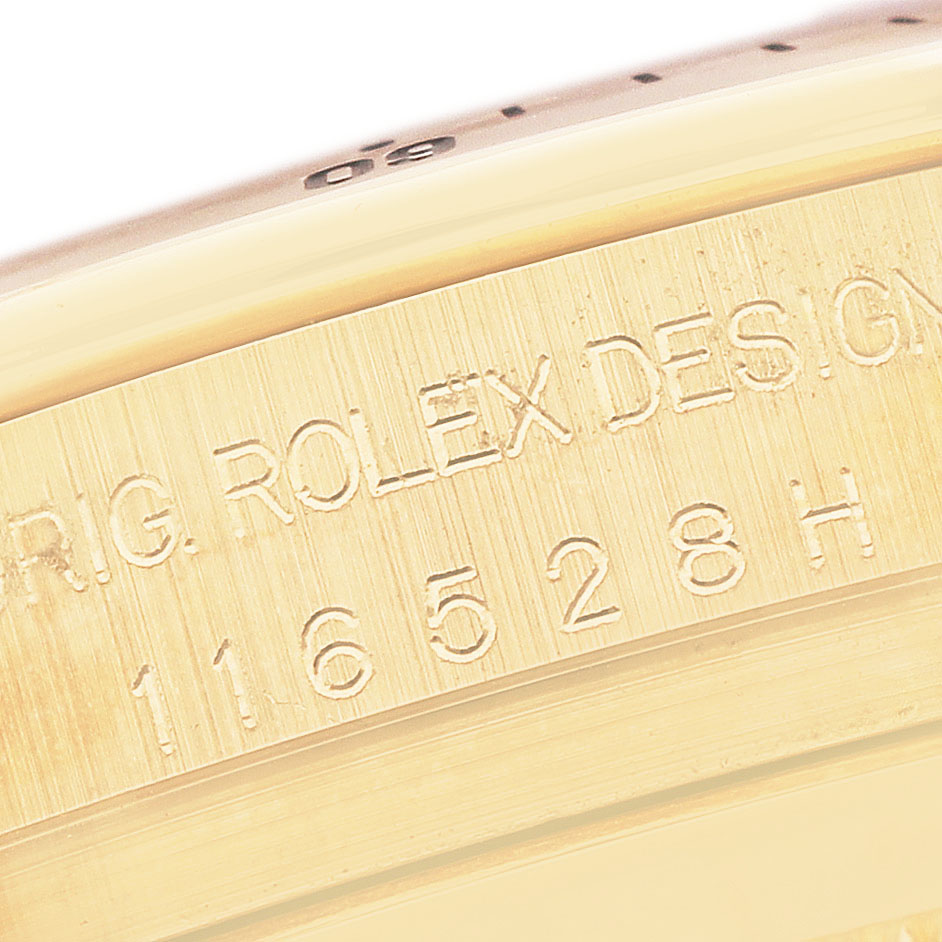 The image shows a close-up of the engraved side of the Rolex Daytona 116528 Men's Yellow Gold Mother of Pearl Dial watch case.
