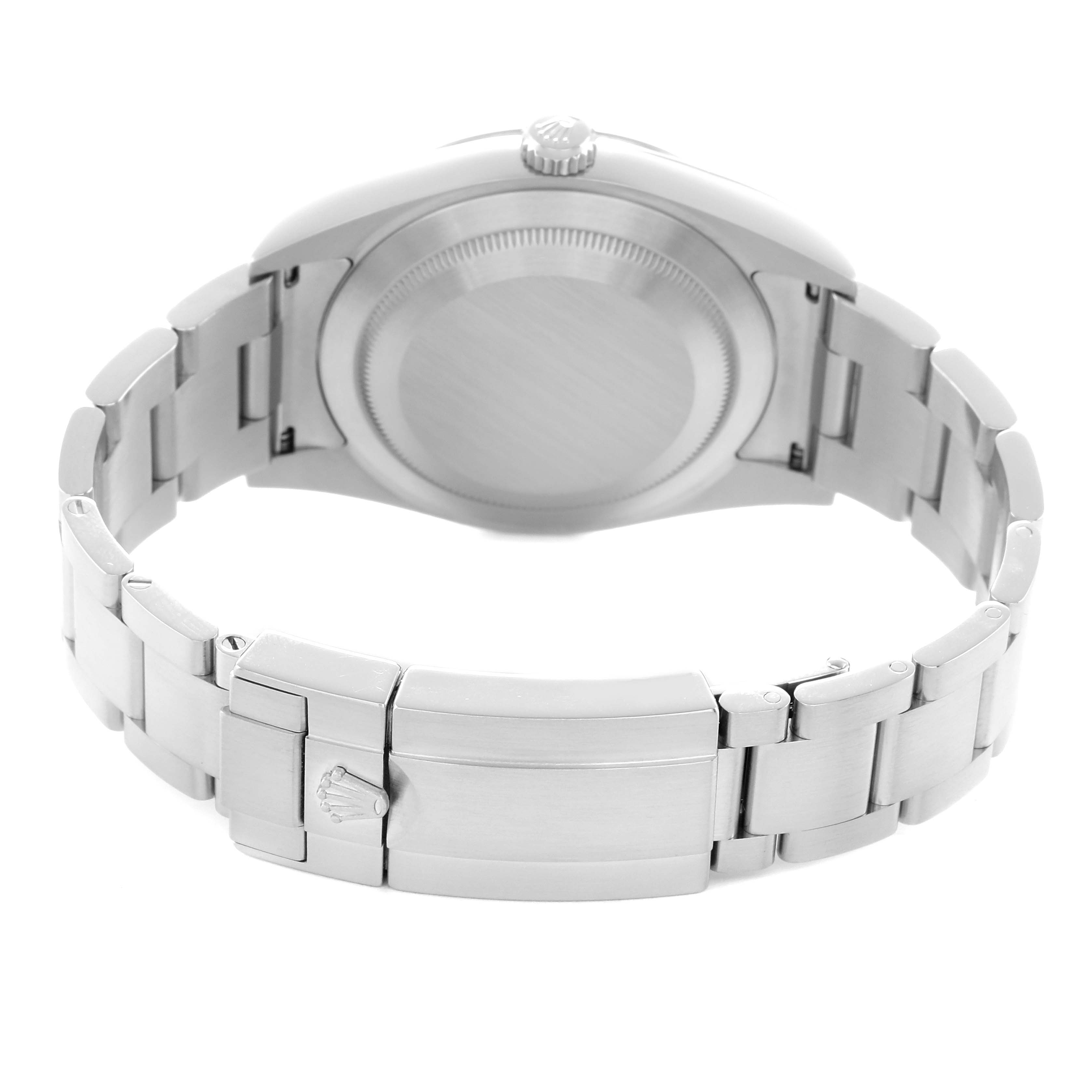 The image shows the back of a Rolex Explorer 214270 Men
s Stainless Steel Black Dial watch, highlighting the clasp, bracelet, and case back.