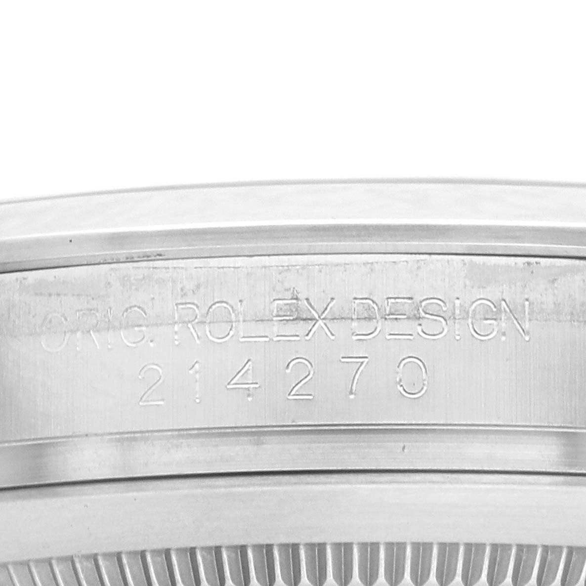 The image shows a close-up of the inner case of a Rolex Explorer 214270 Men
s Stainless Steel Black Dial, displaying its design number, 214270.