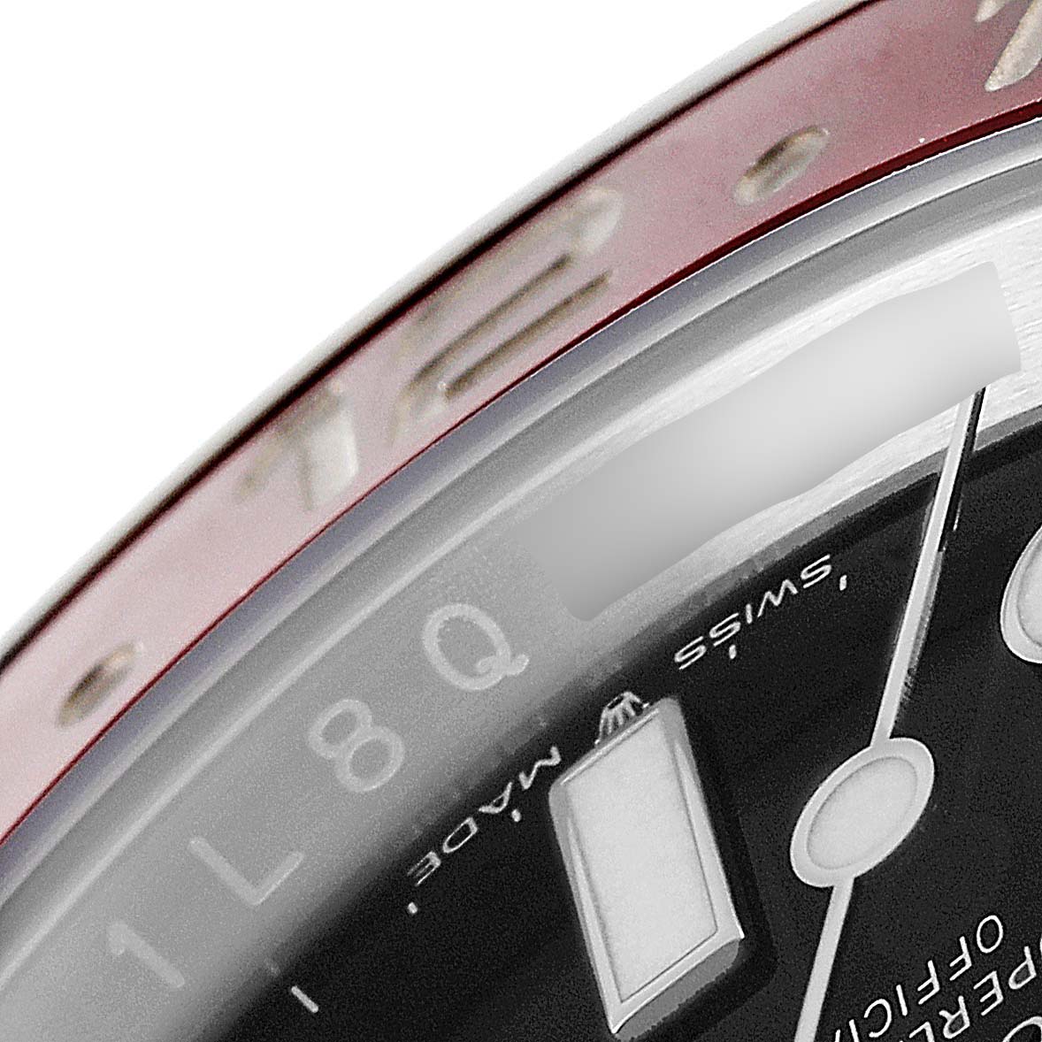 This close-up image shows parts of the bezel, dial, and hour hand of the Rolex GMT-Master 126710 Men
s Stainless Steel Black Dial 126710 Men
s Stainless Steel Black Dial watch.