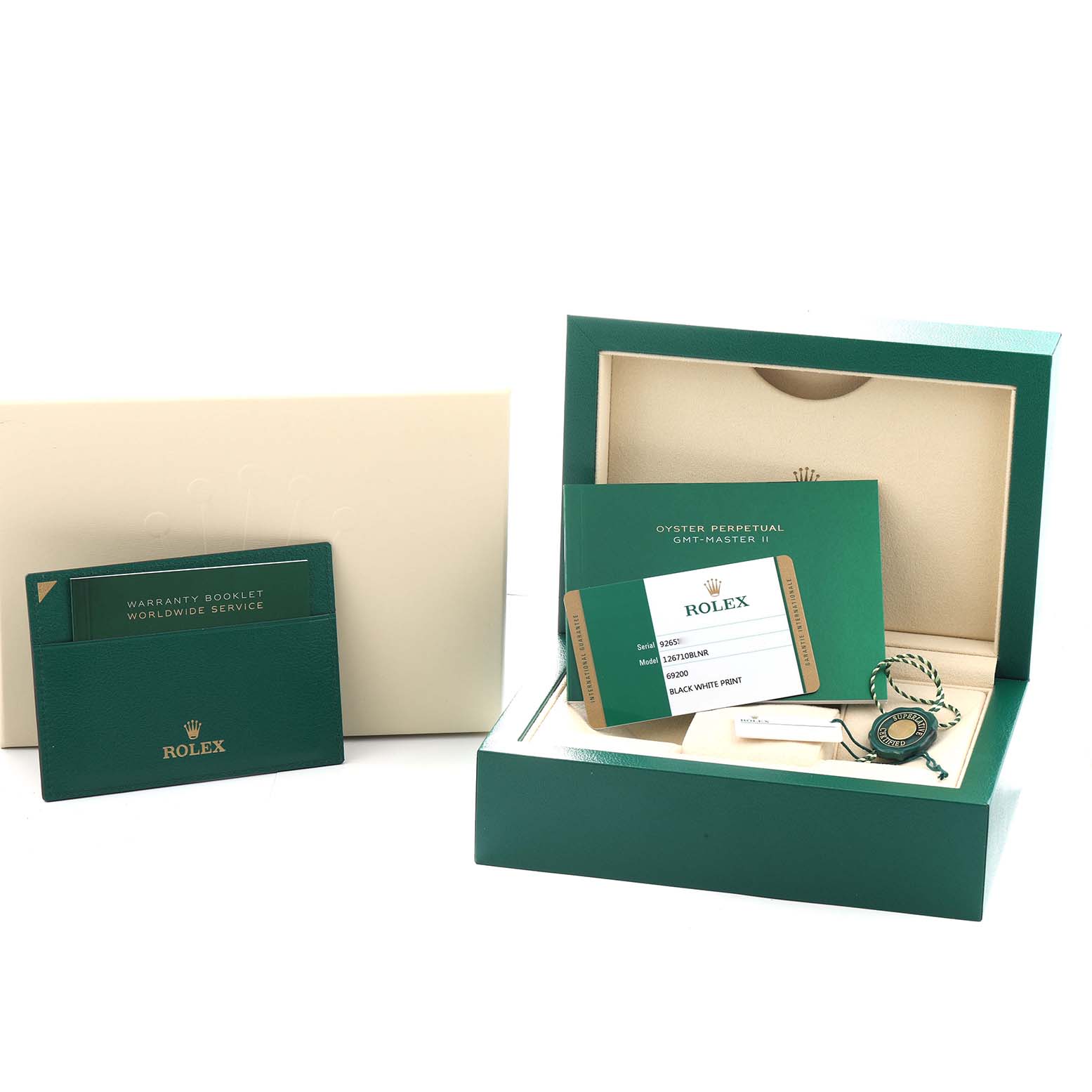 This image shows the Rolex GMT-Master 126710 Men
s Stainless Steel Black Dial
s packaging, warranty booklets, tags, and certification documents.