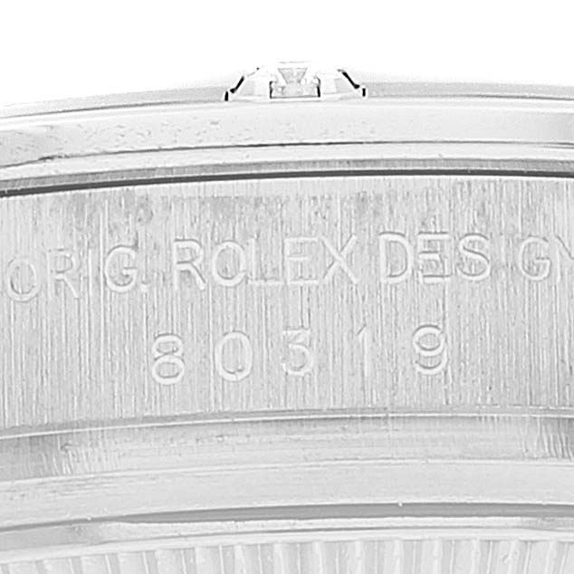 This close-up image shows the engraved case back and edge of a Rolex Pearlmaster 80319 Women's White Gold Mother of Pearl Dial 80319 Women's White Gold Mother of Pearl Dial watch.