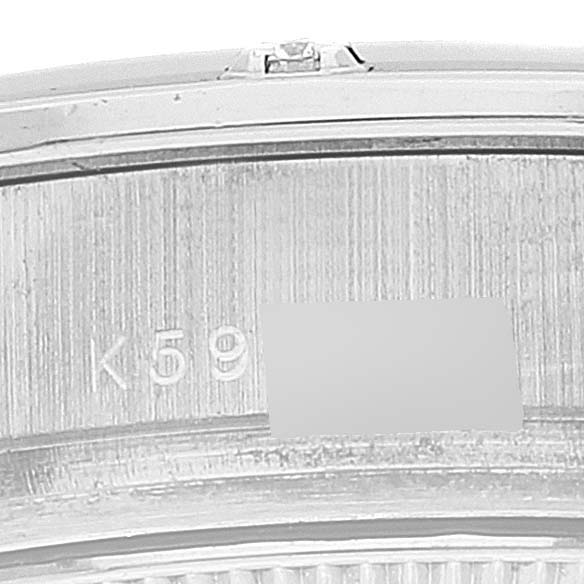 This close-up image shows the inner side of the watch case for a Rolex Pearlmaster 80319 Women's White Gold Mother of Pearl Dial 80319 Women's White Gold Mother of Pearl Dial, highlighting part of the serial number.