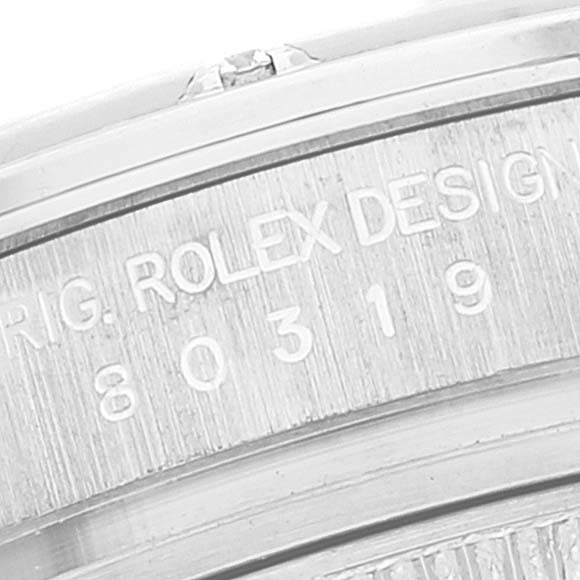 This image shows an angled close-up of the serial number and engraving on a Rolex Pearlmaster 80319 Women's White Gold White Dial 80319 Women's White Gold White Dial watch case.