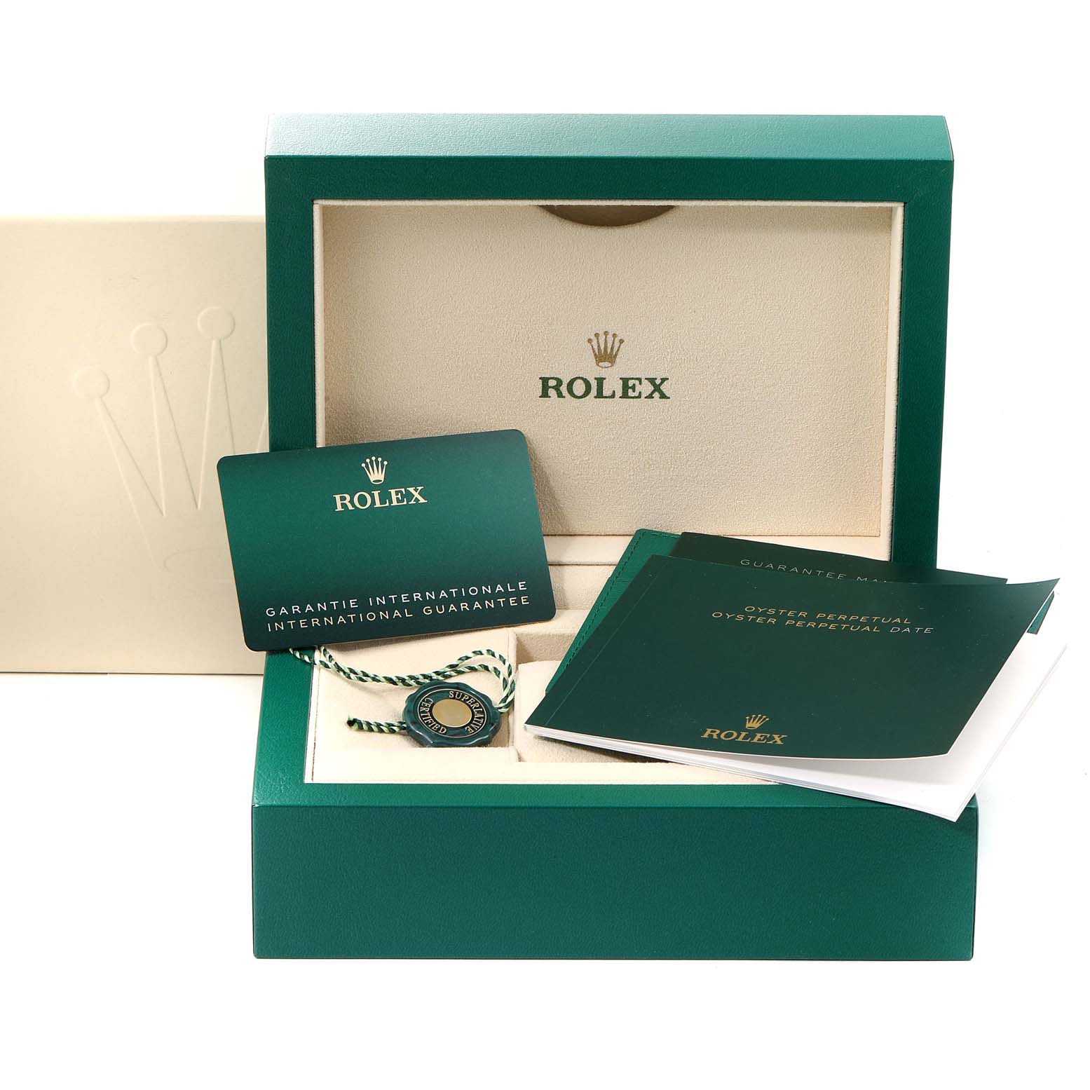 This image shows the open packaging for the Rolex Oyster Perpetual 124200 Men
s Stainless Steel Black Dial 124200 Men
s Stainless Steel Black Dial watch, including the guarantee card, booklet, tags, and watch box.