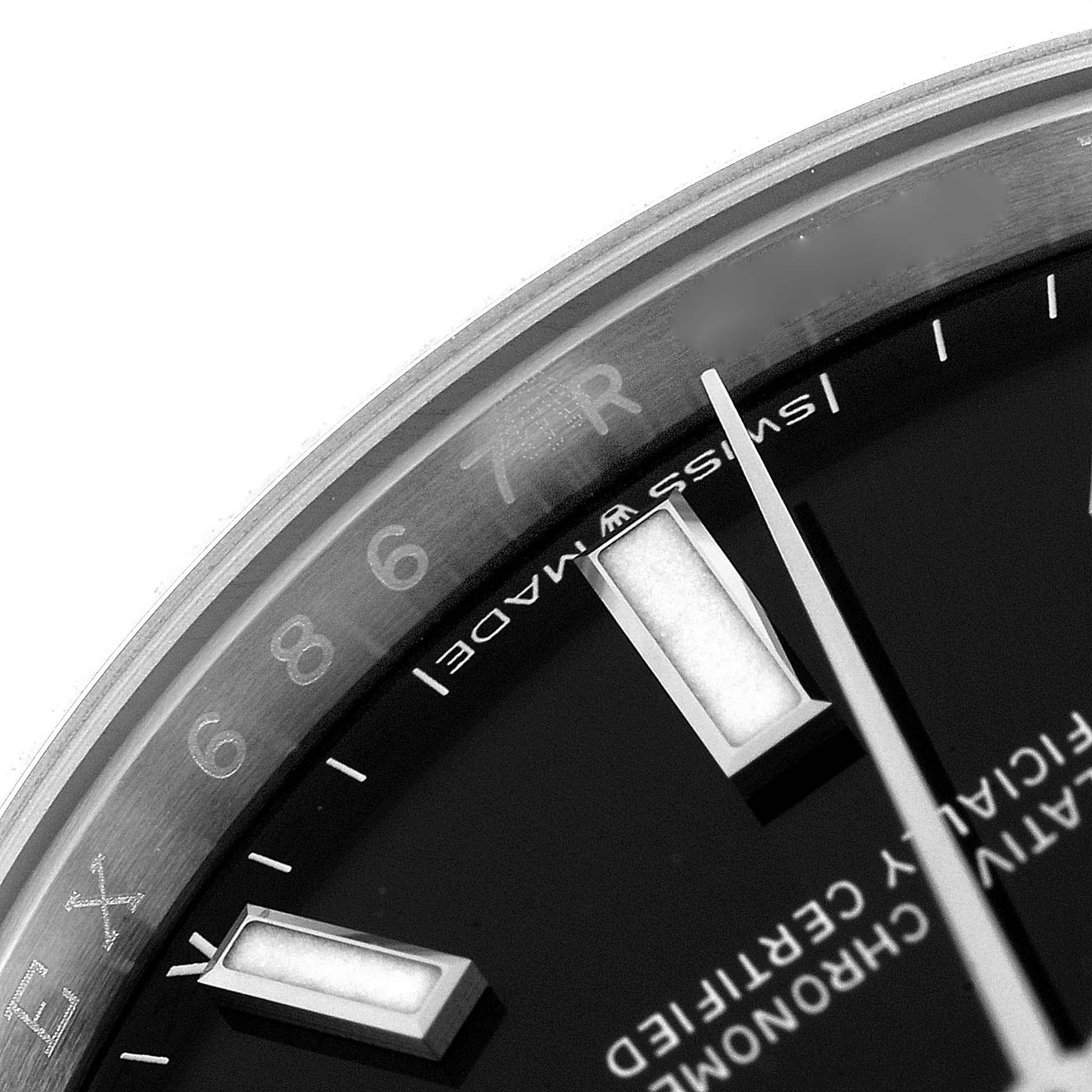 The image shows a close-up of the dial and bezel of a Rolex Oyster Perpetual 124200 Men
s Stainless Steel Black Dial 124200 Men
s Stainless Steel Black Dial watch, highlighting the hour marker and the "Swiss Made" text.