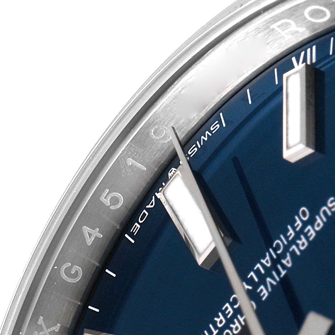 This close-up shows the edge of the dial, hour markers, and hands of a Rolex Oyster Perpetual 124200 Men
s Stainless Steel Blue Dial 124200 Men
s Stainless Steel Blue Dial watch.