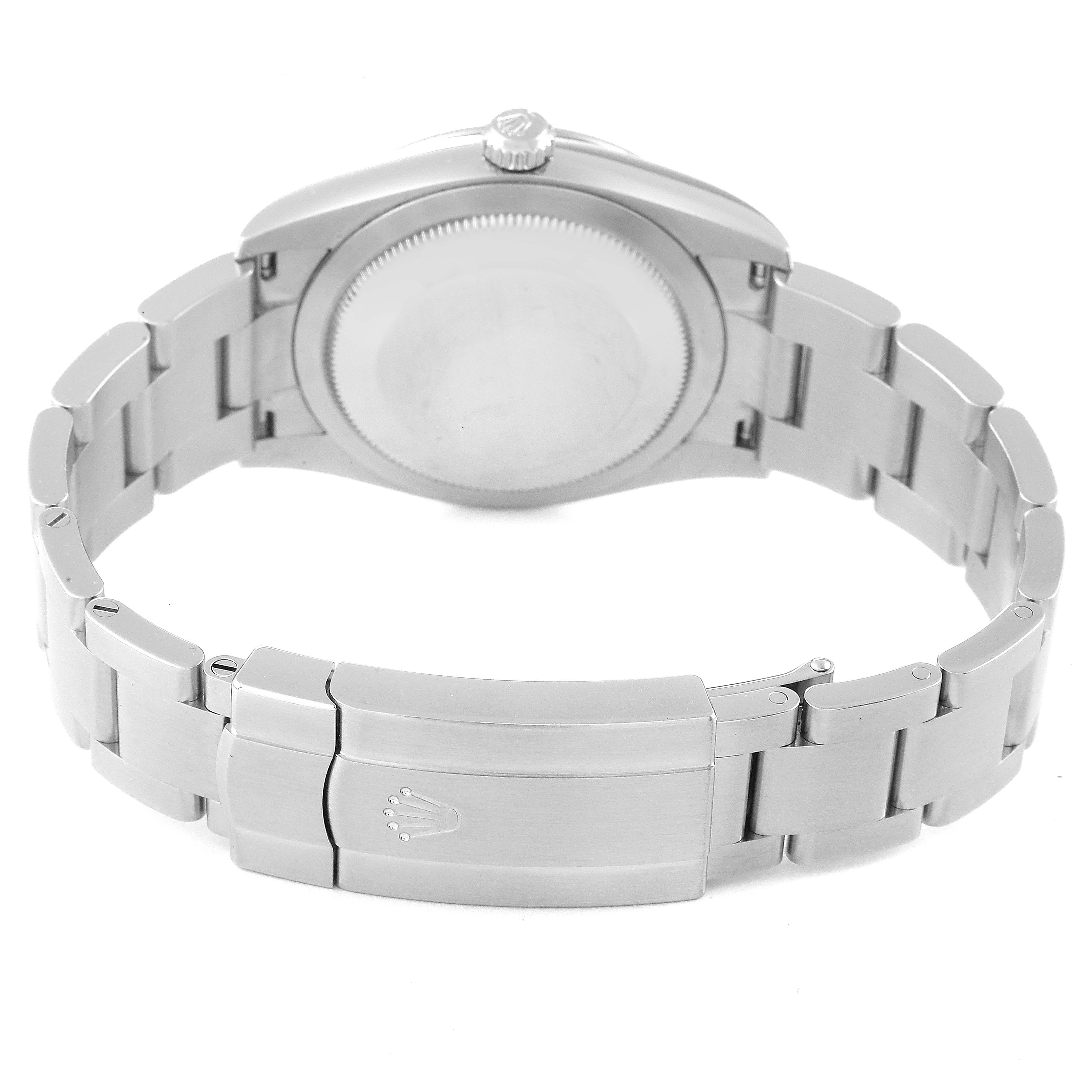 The image shows the back case and bracelet clasp of a Rolex Oyster Perpetual 124200 Men
s Stainless Steel Blue Dial 124200 Men
s Stainless Steel Blue Dial watch from a rear angle.