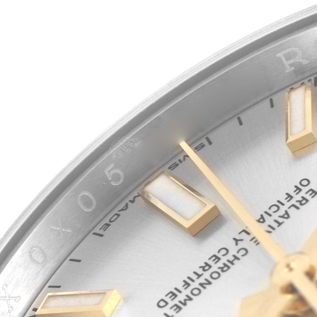This close-up image shows the dial, part of the bezel, and the minute hand of a Rolex Oyster Perpetual 124200 Men's Stainless Steel Silver Dial 124200 Men's Stainless Steel Silver Dial watch.