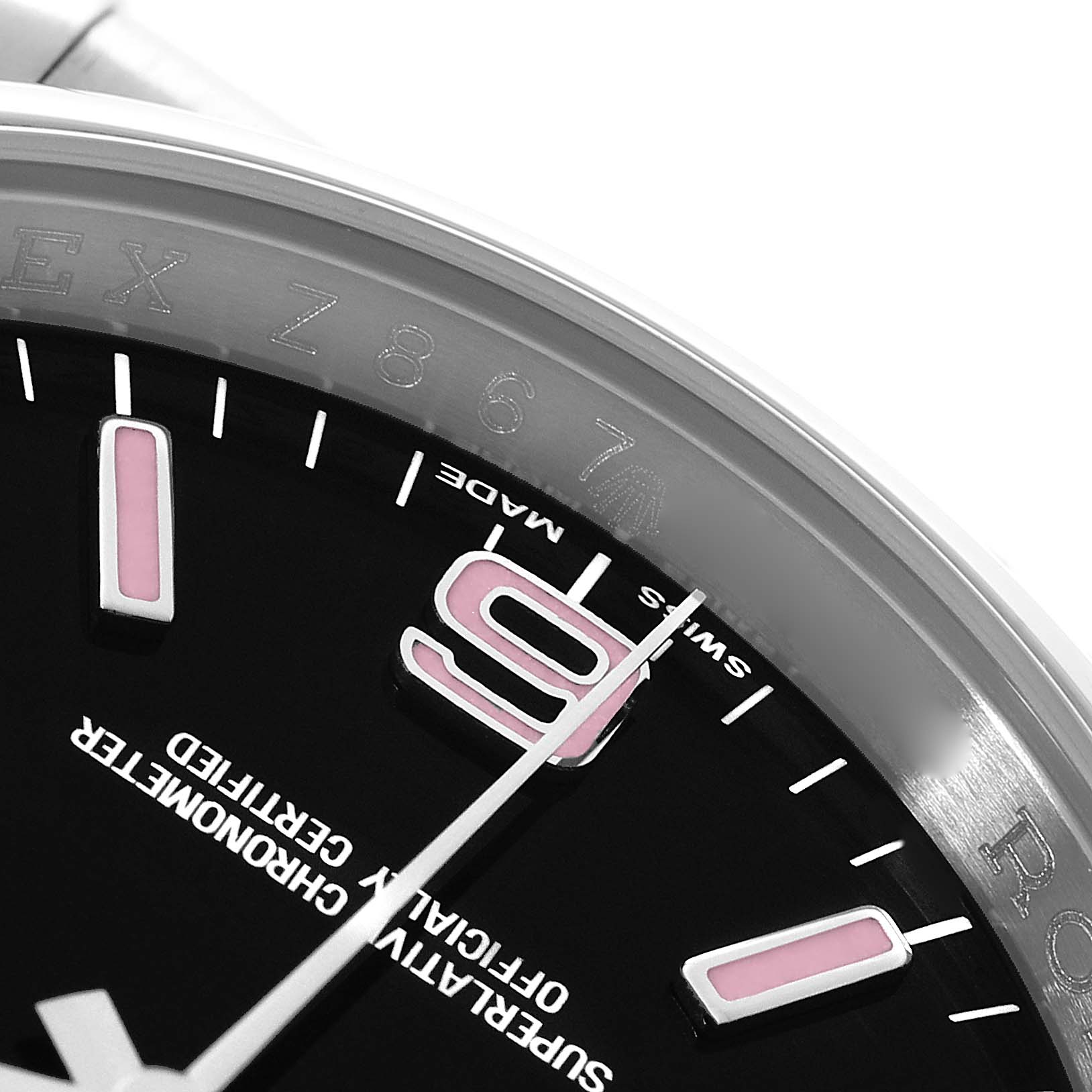 This image shows a close-up angle of the face and bezel of a Rolex Oyster Perpetual 116000 Men
s Stainless Steel Black Dial 116000 Men
s Stainless Steel Black Dial watch, highlighting the 9 o
clock marker and second hand.
