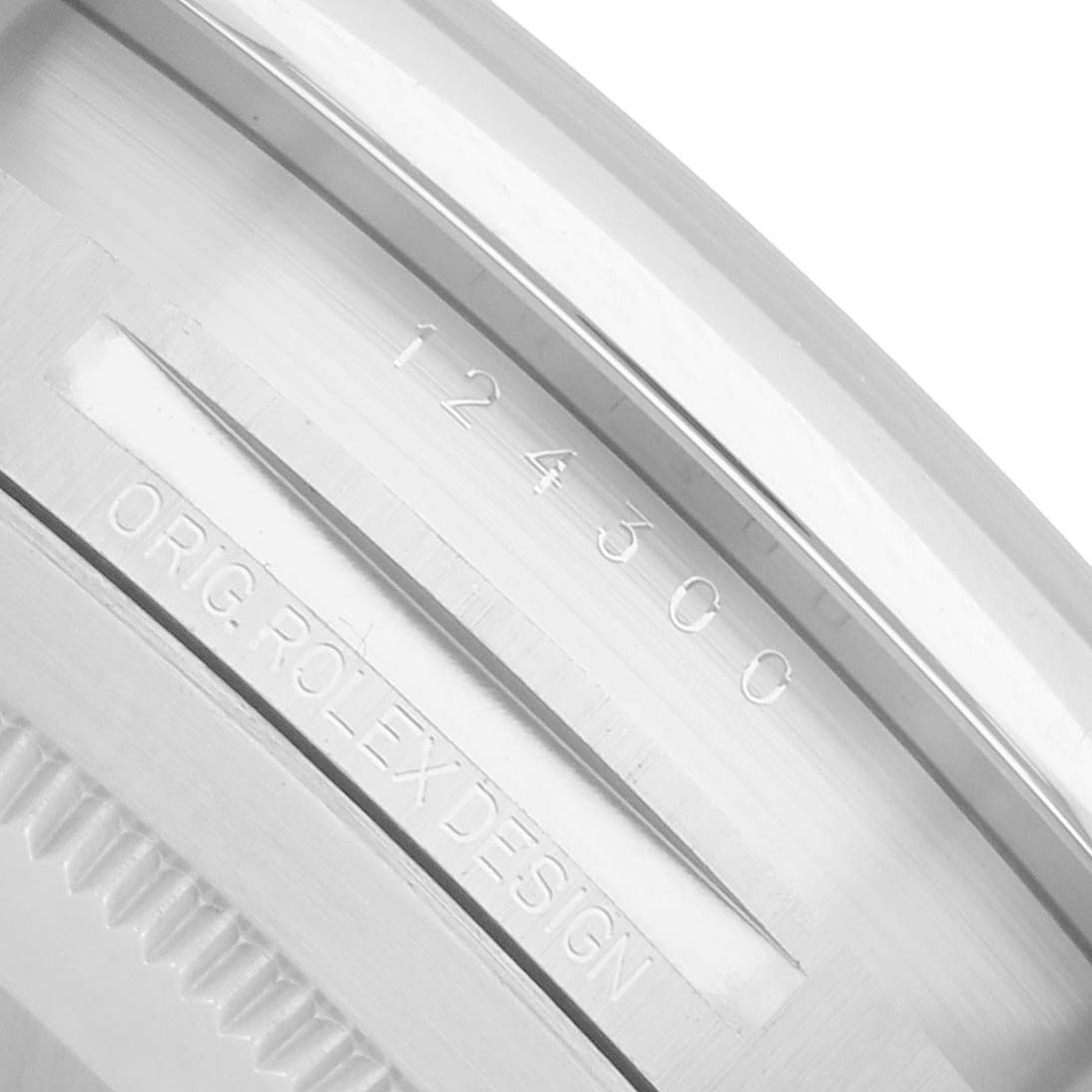 The image shows a close-up angle of the Rolex Oyster Perpetual 124300 Men
s Stainless Steel Silver Dial, focusing on the engraved serial and design numbers on the case.
