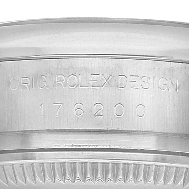 This image shows a close-up of the case
s edge engraving on a Rolex Oyster Perpetual 176200 Women
s Stainless Steel Silver Dial 176200 Women
s Stainless Steel Silver Dial watch.