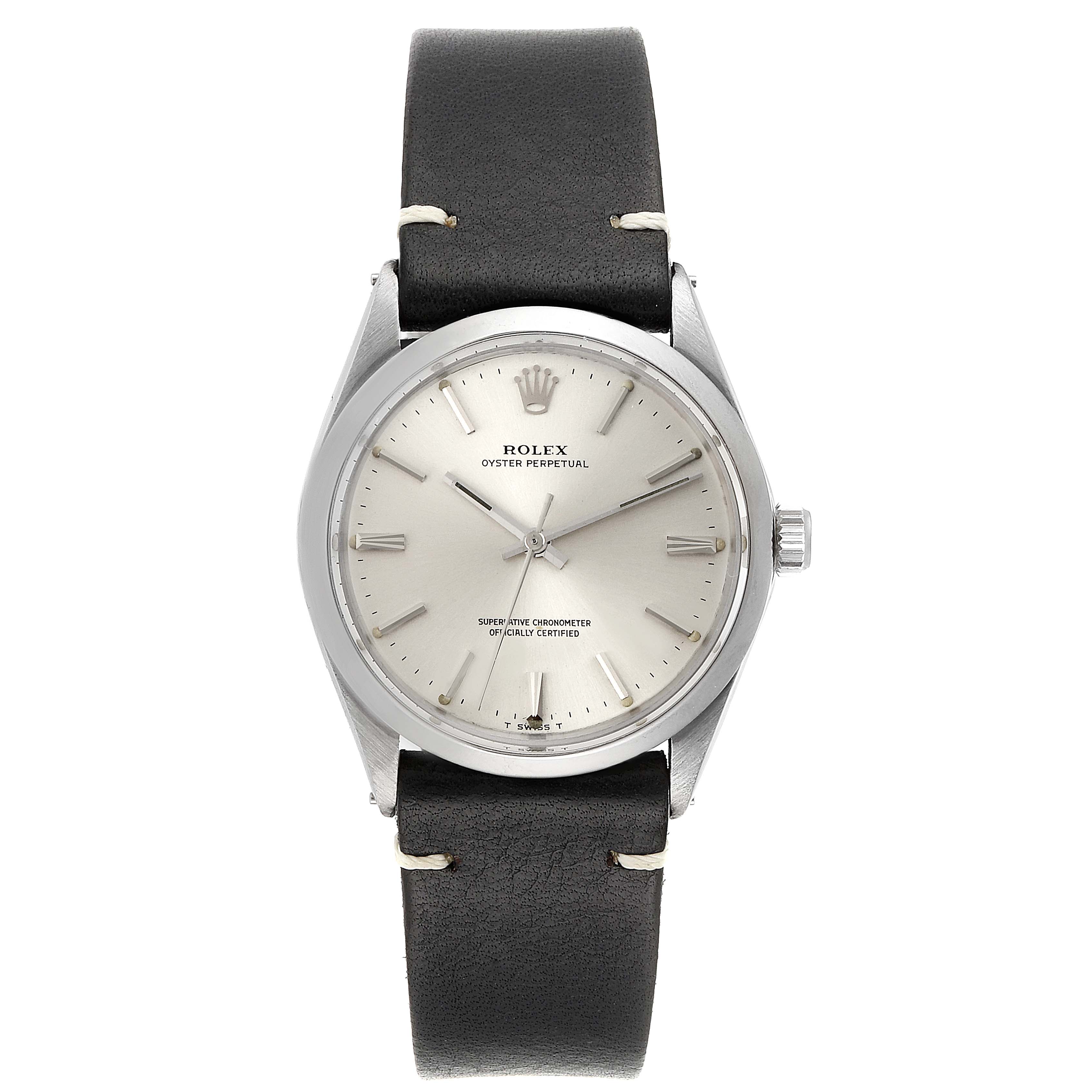 The image shows a Rolex Oyster Perpetual 1002 Men's Stainless Steel Silver Dial 1002 Men's Stainless Steel Silver Dial watch from a frontal view, highlighting its dial, bezel, and leather strap.