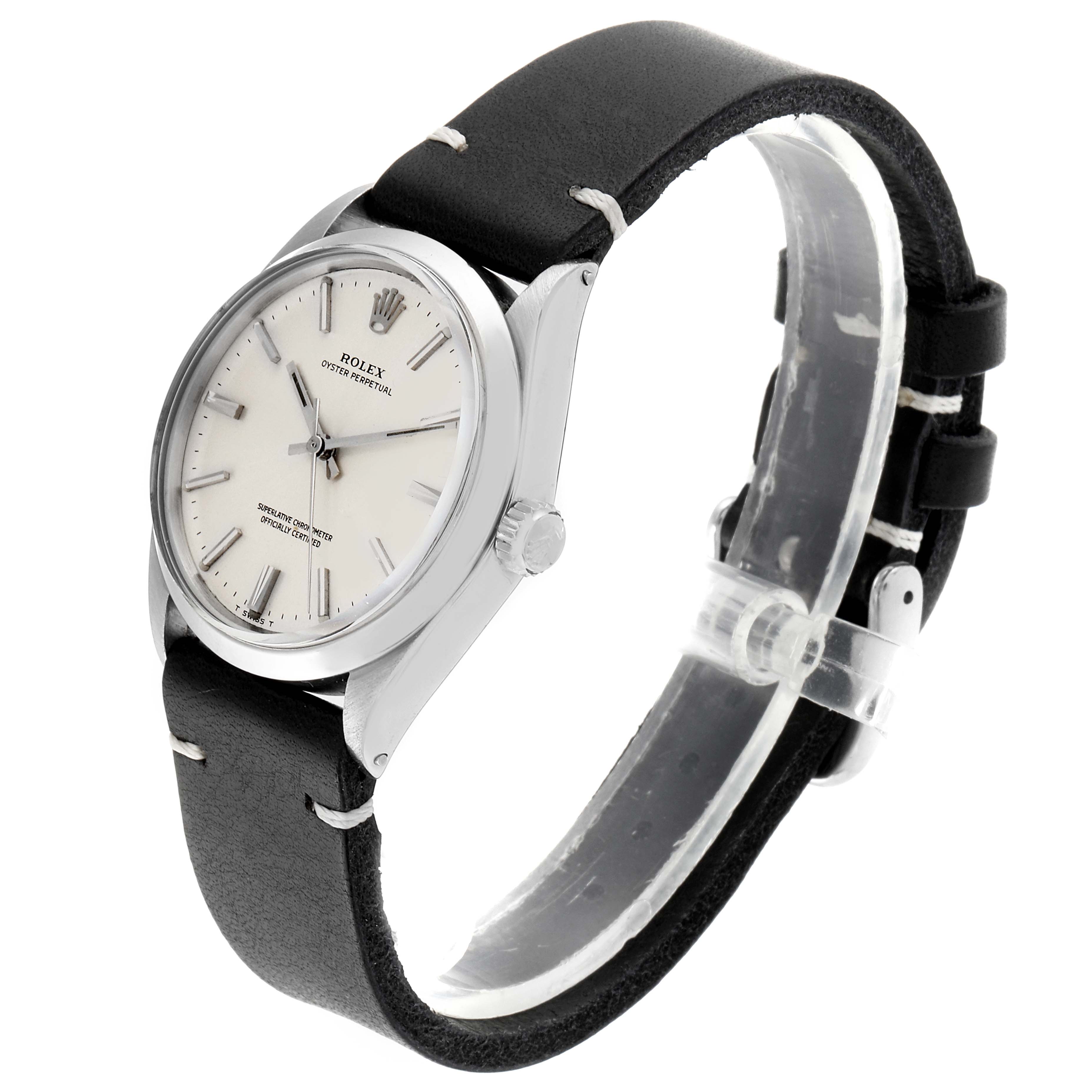 The image shows a side view of a Rolex Oyster Perpetual 1002 Men's Stainless Steel Silver Dial 1002 Men's Stainless Steel Silver Dial watch, highlighting the dial, case, crown, and leather strap.