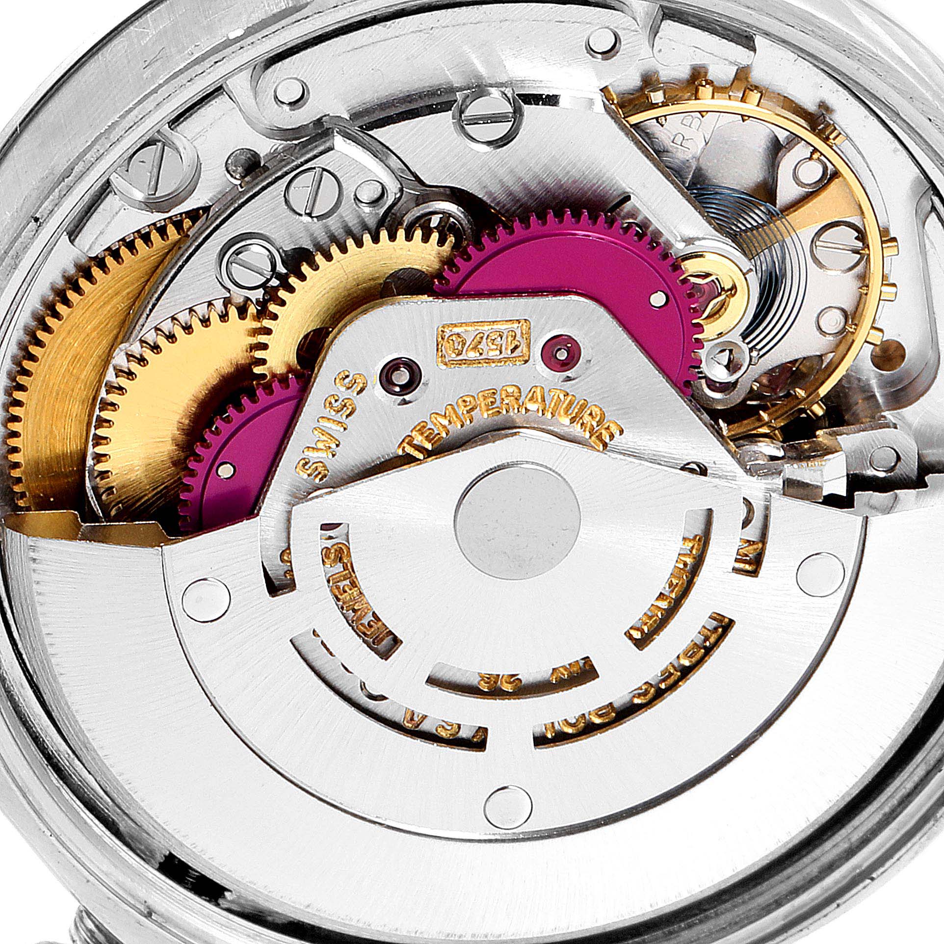This image shows the internal movement mechanism of the Rolex Oyster Perpetual 1002 Men's Stainless Steel Silver Dial 1002 Men's Stainless Steel Silver Dial watch, highlighting its gears and intricate parts.