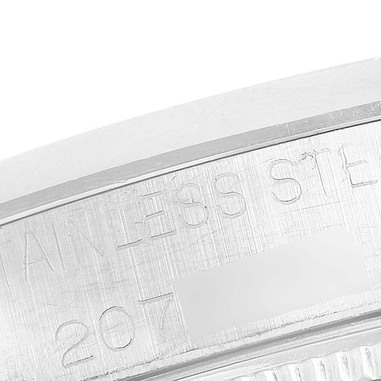This image shows a close-up of the case back edge of a Rolex Oyster Perpetual 1002 Men's Stainless Steel Silver Dial 1002 Men's Stainless Steel Silver Dial watch, highlighting the engraved text.