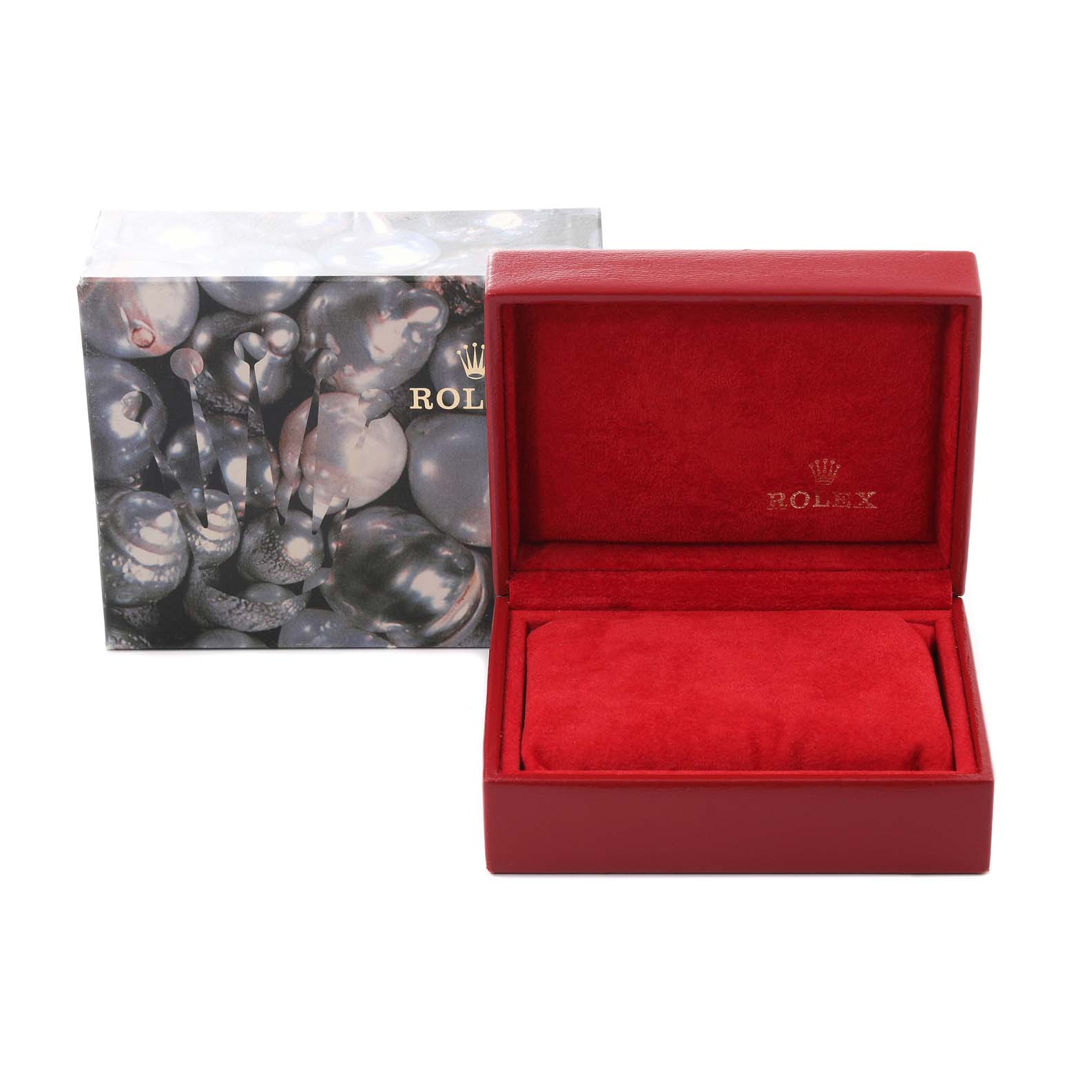 The image shows a Rolex Oyster Perpetual 76094 Women's Stainless Steel Silver Dial 76094 Women's Stainless Steel Silver Dial watch box and its decorative outer packaging.