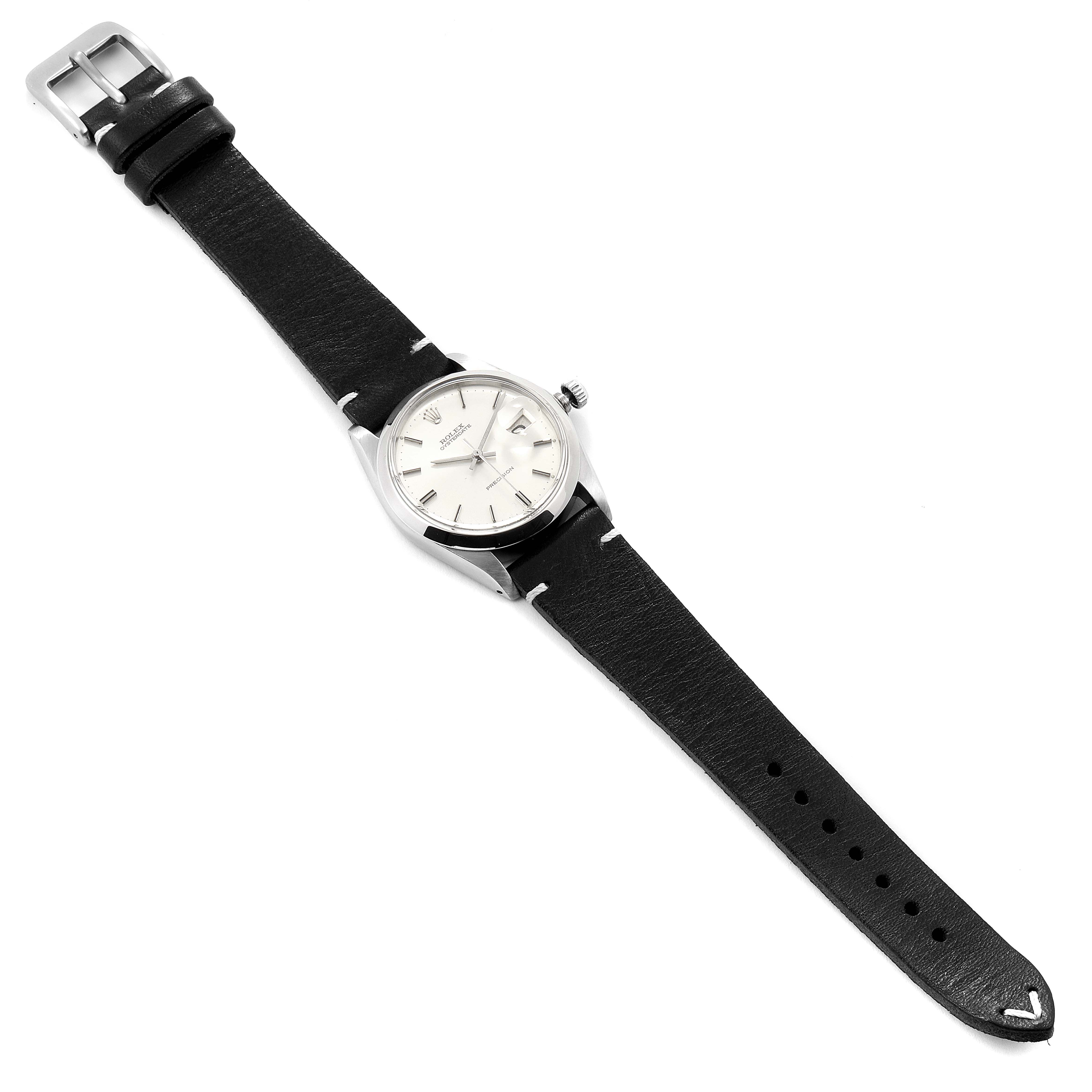 The image shows a Vintage Collection Rolex watch at an angled top view, displaying the face, crown, and entire leather strap.