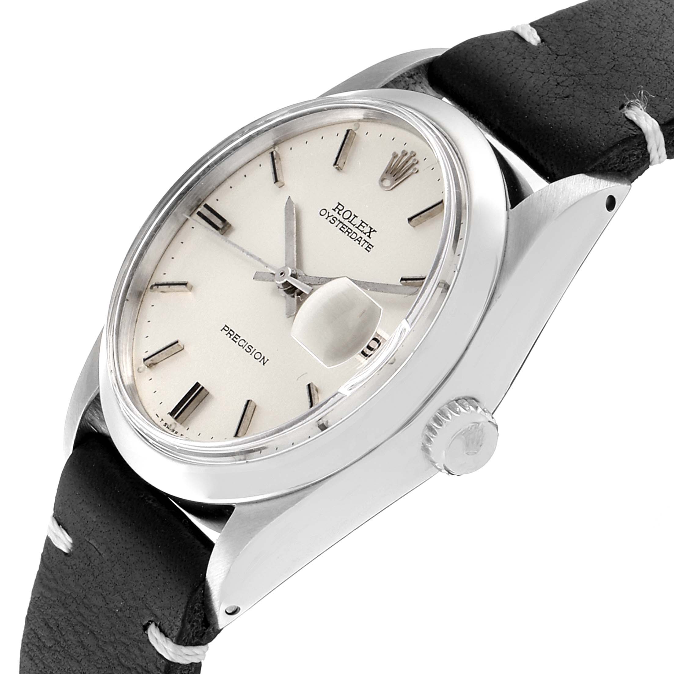 The image shows a Vintage Collection model by Rolex angled to display the dial, crown, and leather strap.