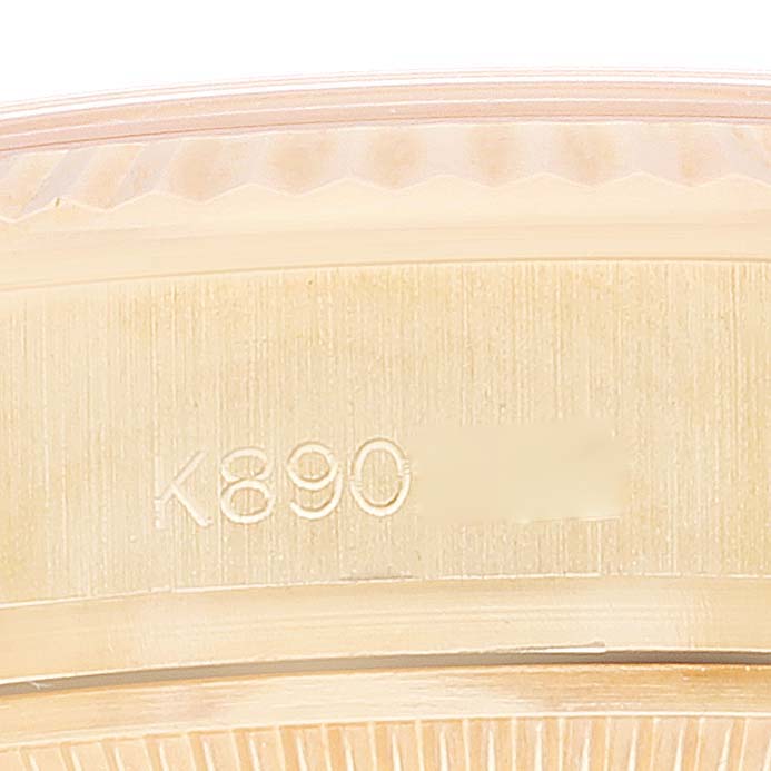 This image shows a close-up of the serial number engraving on the side of a Rolex President 179178 Women's Yellow Gold Champagne Dial 179178 Women's Yellow Gold Champagne Dial model watch.