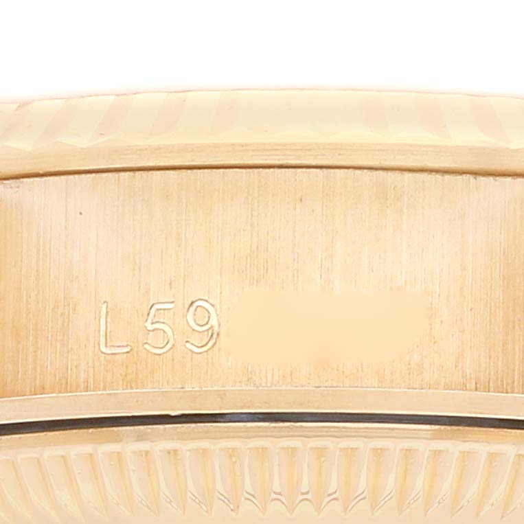 This close-up image shows the case back and part of the serial number of a Rolex President 69178 Women
s Yellow Gold Champagne Dial 69178 Women
s Yellow Gold Champagne Dial model watch.
