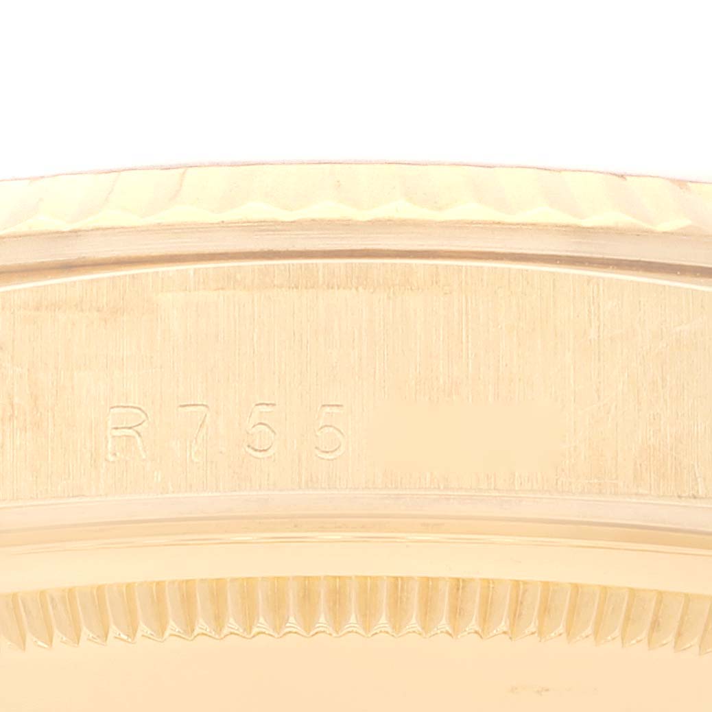 This image shows a close-up of the case side and bezel engraving on a Rolex President 18238 Men
s Yellow Gold Champagne Dial 18238 Men
s Yellow Gold Champagne Dial model watch.