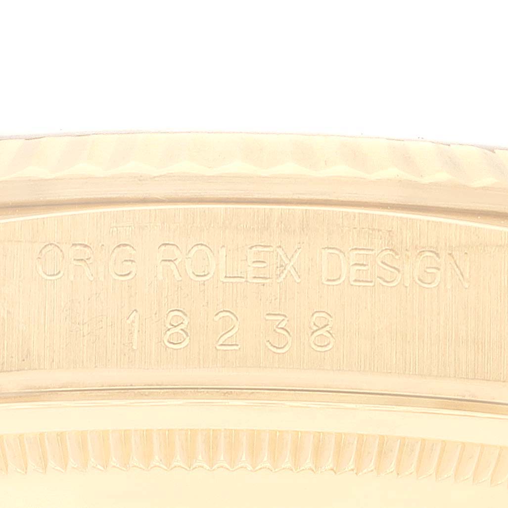 This image shows a close-up of the case back engravings of a Rolex President 18238 Men
s Yellow Gold Champagne Dial 18238 Men
s Yellow Gold Champagne Dial model with the design number 18238.