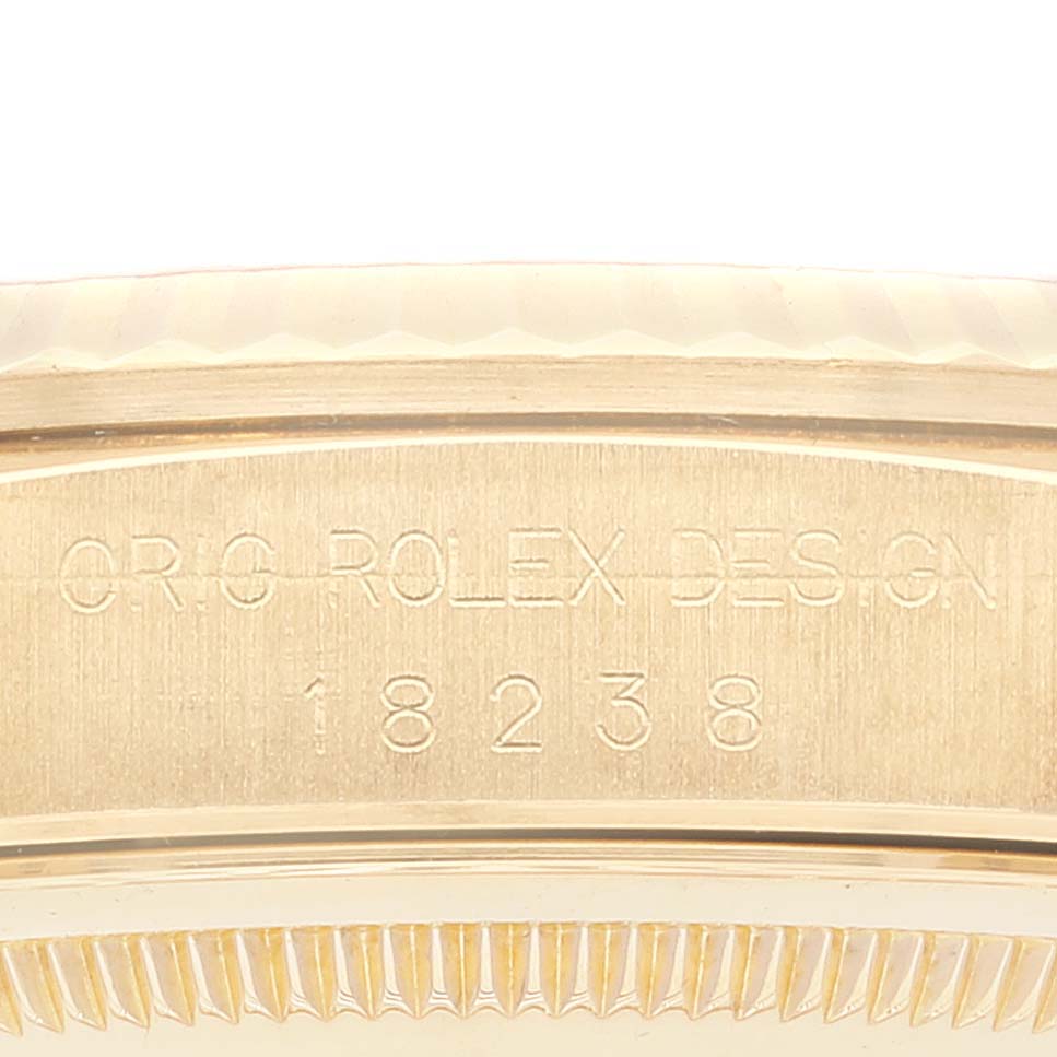 The image shows a close-up of the side engraving on a Rolex President 18238 Men's Yellow Gold Champagne Dial 18238 Men's Yellow Gold Champagne Dial model, showcasing the Rolex design number "18238".