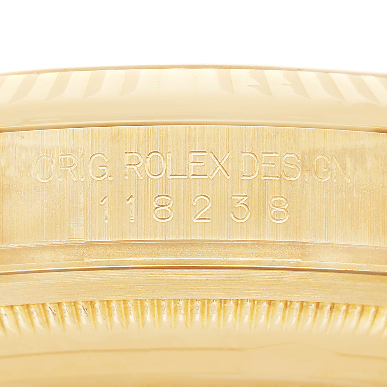 The image shows the side view of a Rolex President 118238 Men's Yellow Gold Champagne Dial model, focusing on the engraved design and model number on the case.