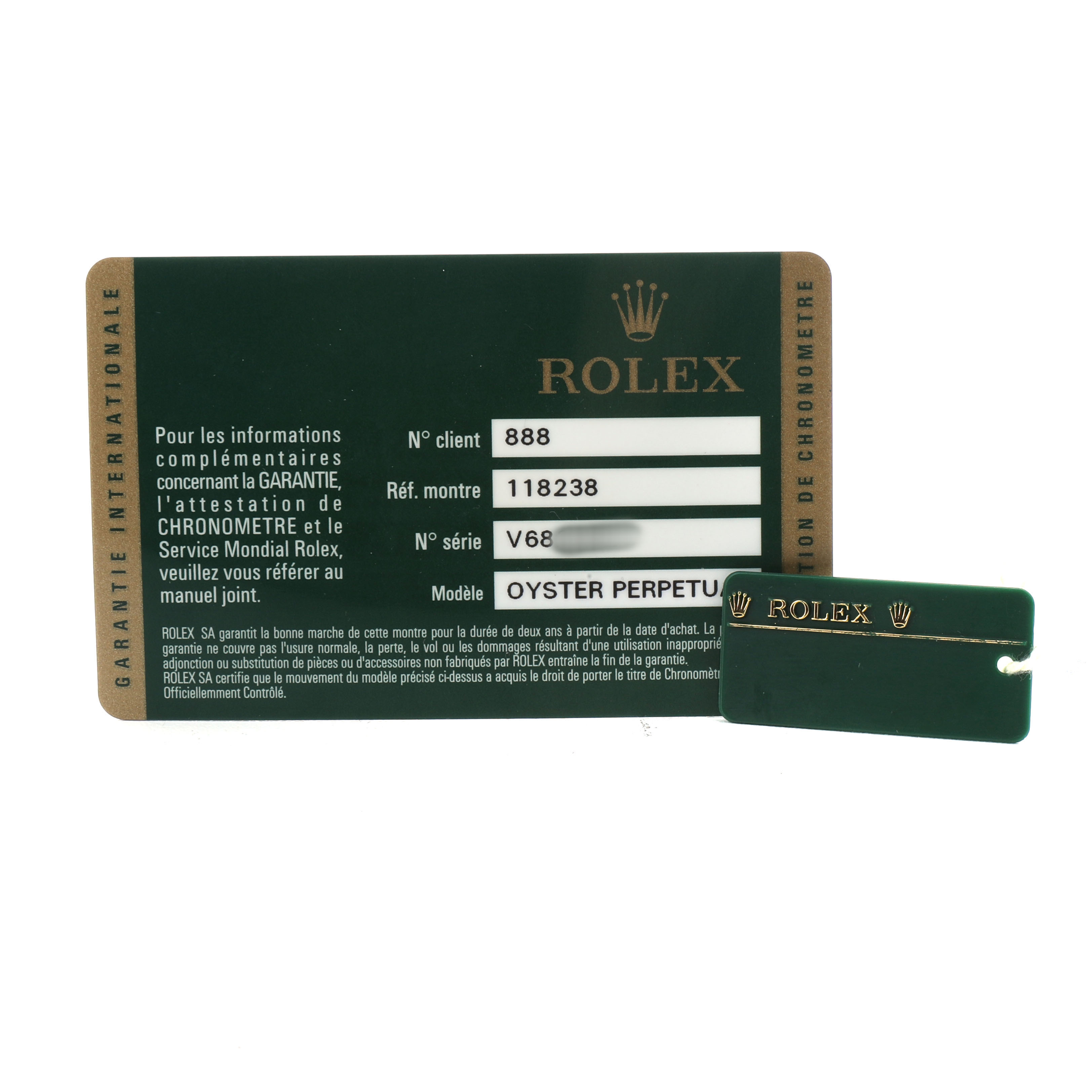 The image shows a warranty card and tag for a Rolex Oyster Perpetual President model, providing reference and serial numbers.