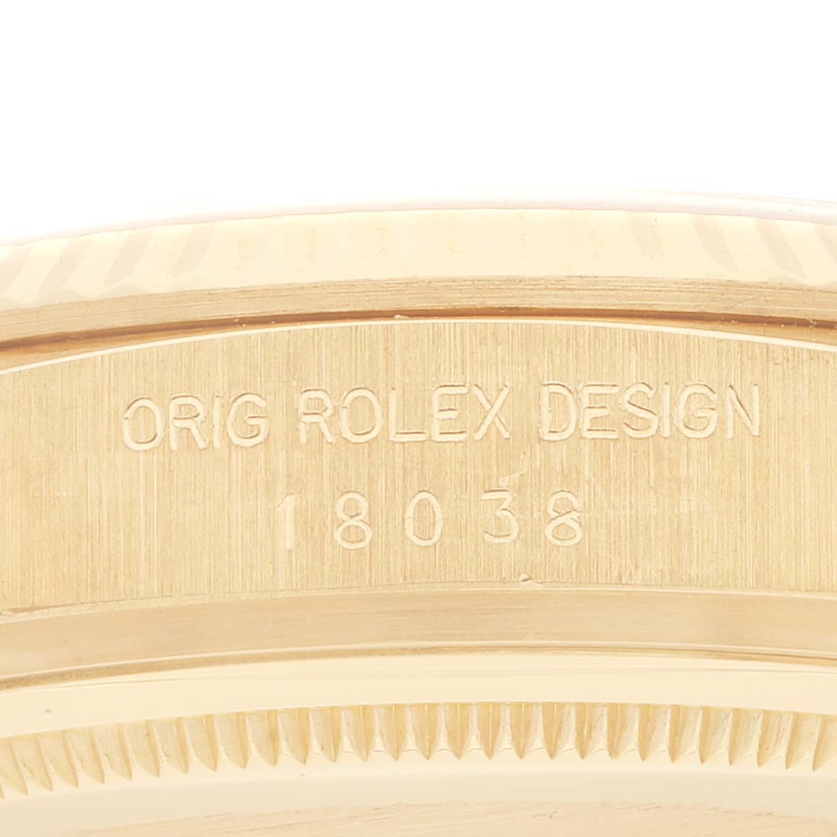 The image shows an angled close-up of the case back portion of the President model by Rolex, featuring engraved details.