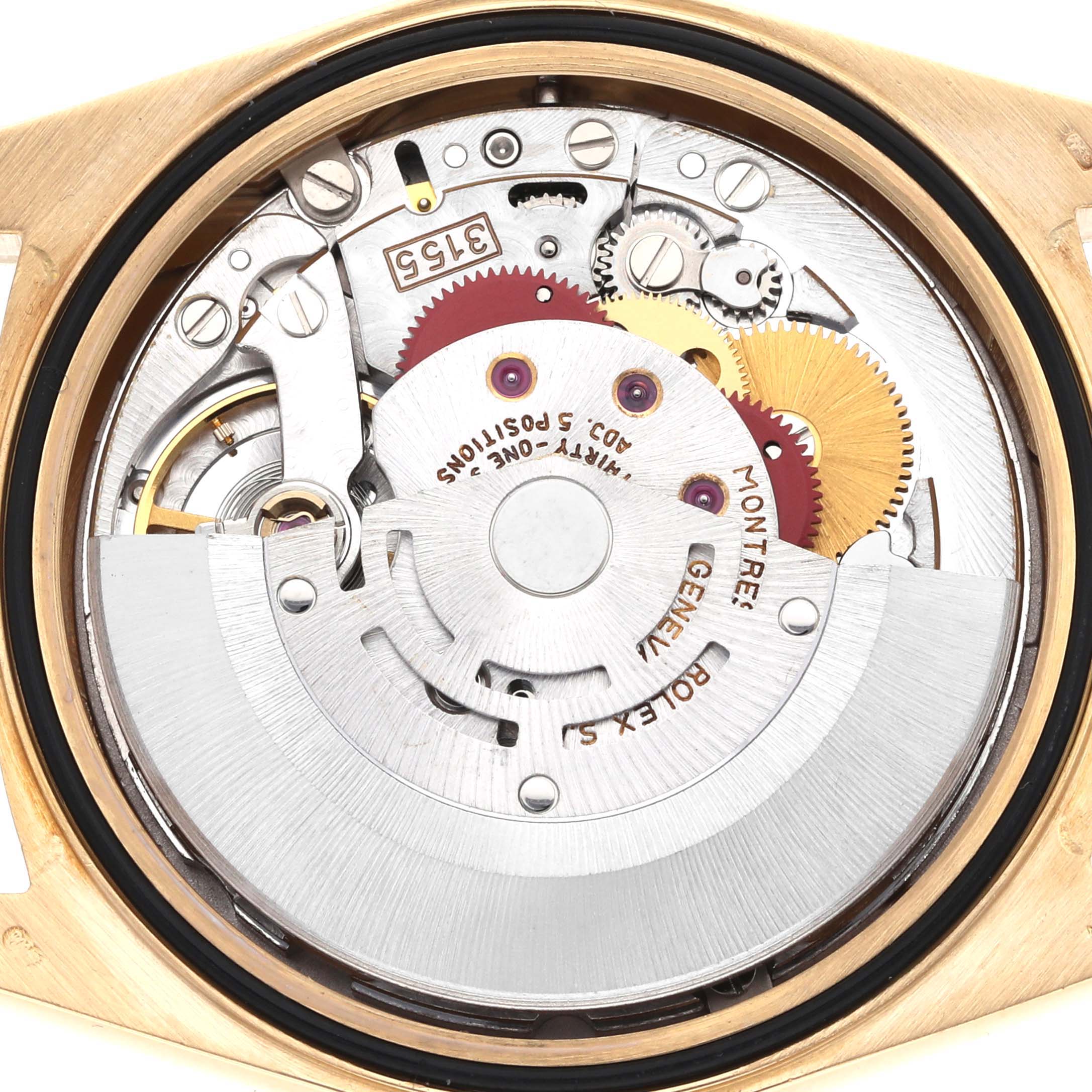 The image shows the movement of the Rolex President 18238 Men
s Yellow Gold Champagne Dial model watch from a top-down perspective, highlighting gears and mechanisms.
