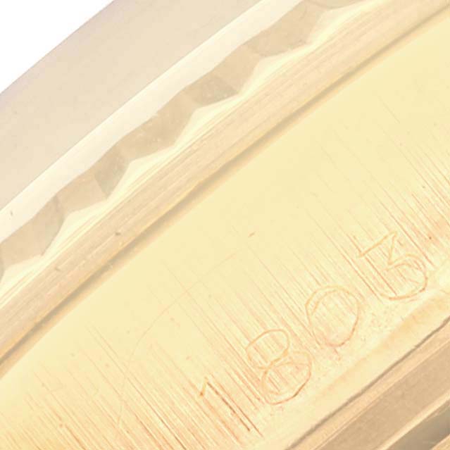 A close-up angle showing the engraved edge of the bezel on the Rolex Vintage Collection 1803 Men's Yellow Gold Silver Dial 1803 Men's Yellow Gold Silver Dial model.