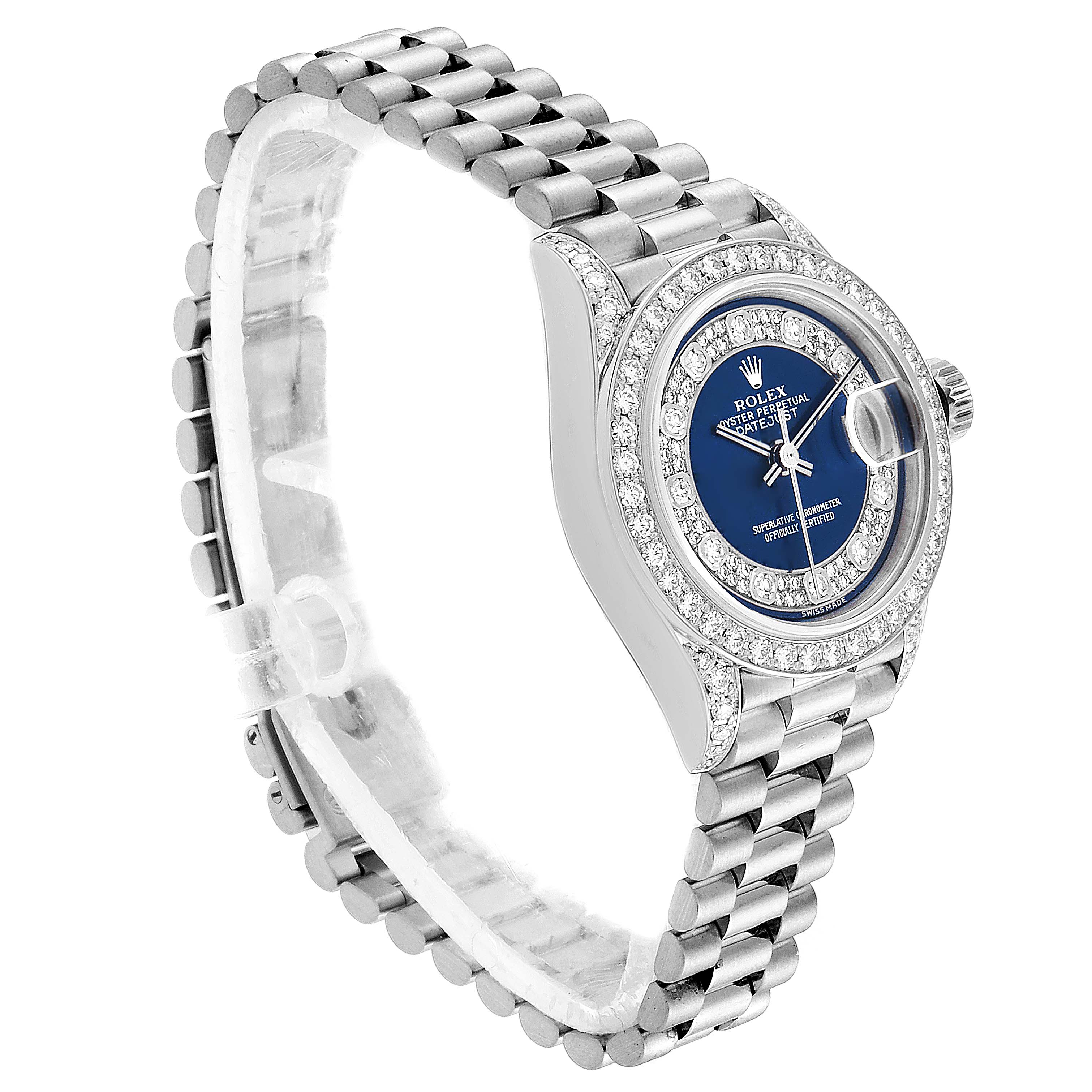 The Rolex President 79159 Women
s White Gold Champagne Dial 79159 Women
s White Gold Champagne Dial model watch shown is angled slightly from the front, displaying its blue dial, bejeweled bezel, and bracelet.