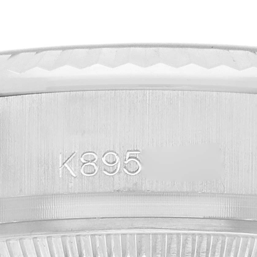 The image shows a close-up of the engraved side of the Rolex President 179179 Women
s White Gold Silver Dial model
s watch case.