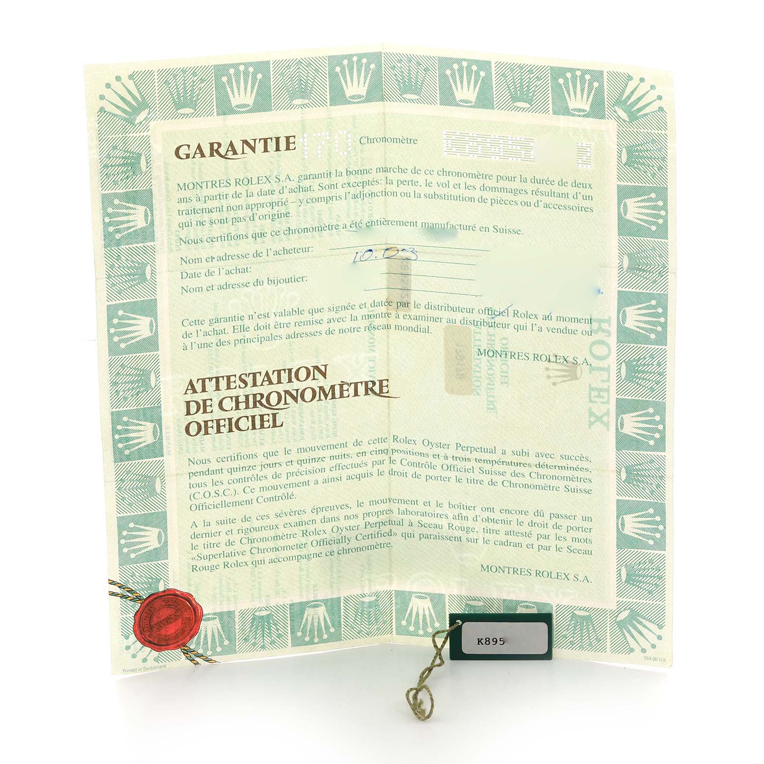The image shows a guarantee certificate and a tag for the Rolex President 179179 Women
s White Gold Silver Dial model laid flat, featuring the Rolex branding and text.