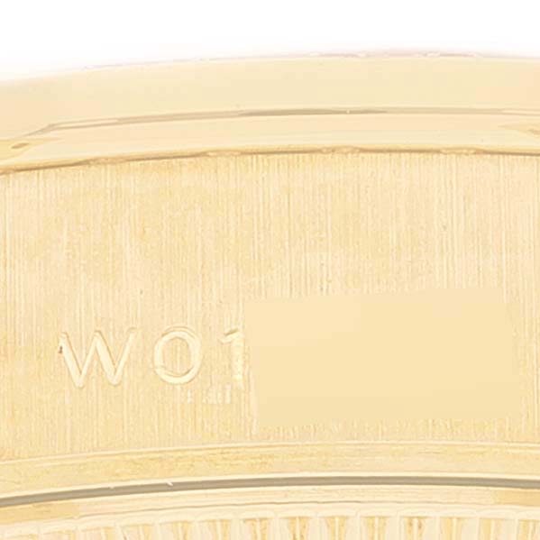 This is a close-up of the serial number engraving on a Rolex President 69158 Women's Yellow Gold Mother of Pearl Dial 69158 Women's Yellow Gold Mother of Pearl Dial watch.