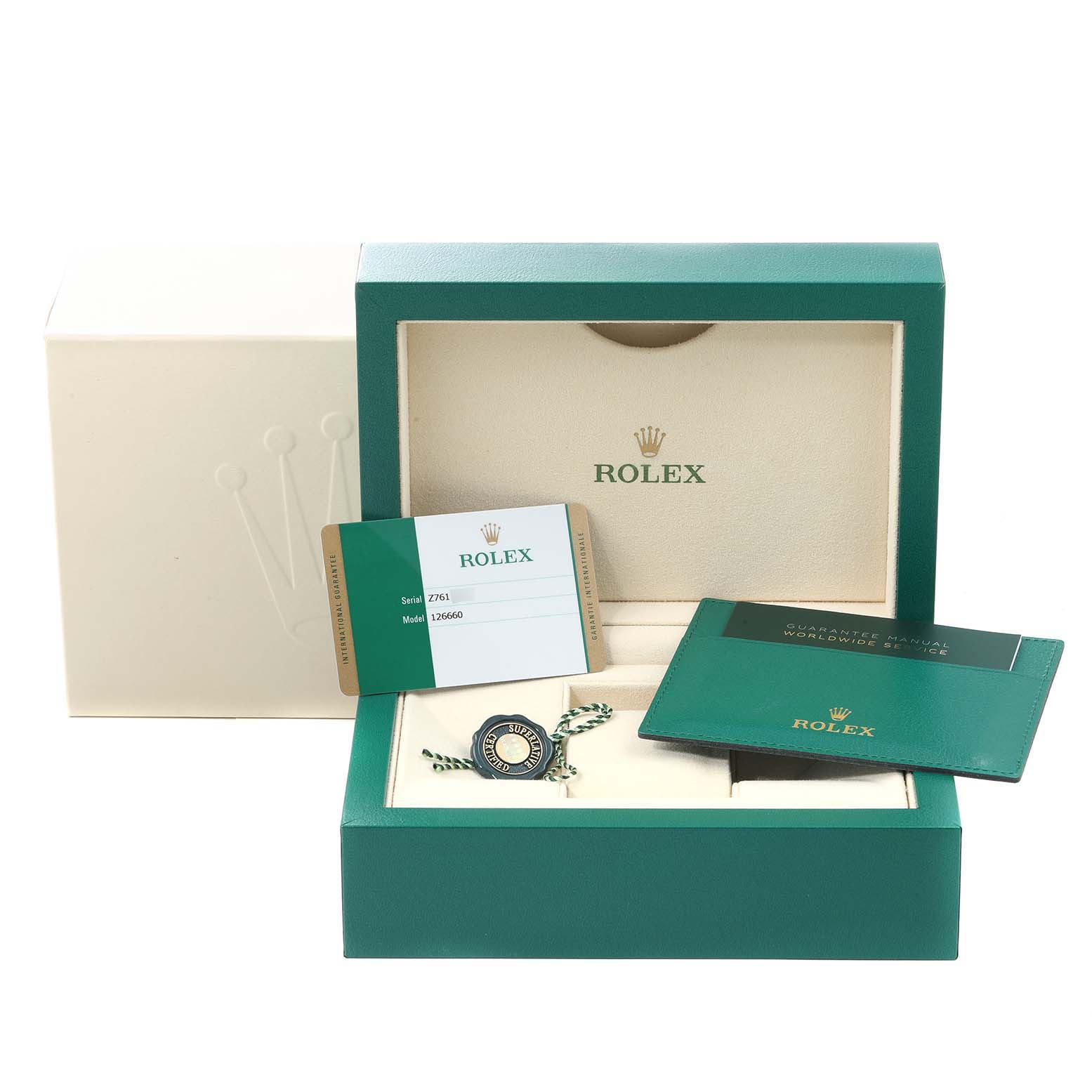 The image shows the box and accessories, including the warranty card, for the Rolex Sea-Dweller 126660 Men
s Stainless Steel Blue Dial 126660 Men
s Stainless Steel Blue Dial model.